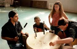 Youth participating in Native American drumming