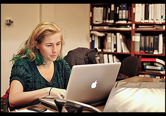 Jean Strout '14 working on a family practice case. Many of her cases involve domestic violence and non-English speaking clients. Courtesy of HLS