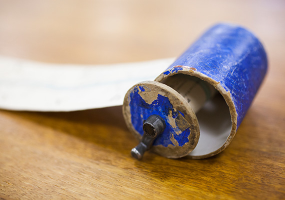 The encasing for one of the longest scroll maps in the collection is pictured up close.