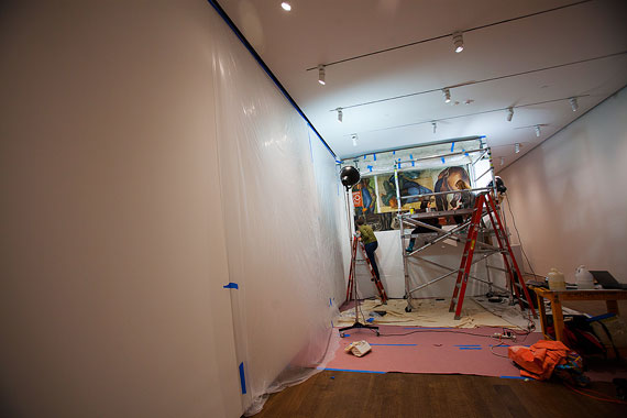 Teri Hensick (from right), Dina Anchin, and Kate Smith work together on the mural by Lewis W. Rubenstein and Rico Lebrun. Photos by Stephanie Mitchell/Harvard Staff Photographer