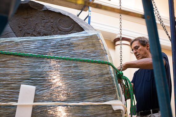 Conservation engineer Jean-Louis Lachevre readies a plaster cast for a move from the second to the third floor of the museum. The exact copy of an Assyrian victory stela was sawed in half for the move. 