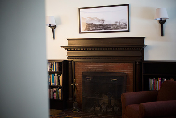 A shot of Northern Ireland by the photographer Rachel Brown hangs above the fireplace in the Seamus Heaney suite. Brown collaborated with the poet on the book “Sweeney’s Flight,” which matches her vivid photos with extracts and quotations from “Sweeney Astray” — Heaney’s translation of the medieval Irish work “Buile Suibhne.” Photos by Stephanie Mitchell/Harvard Staff Photographer