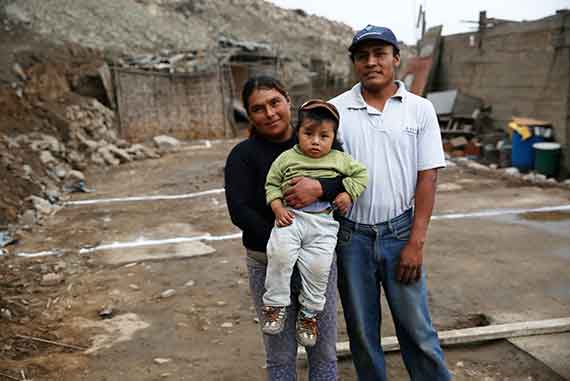 Parents Rebeca Cruz and Angel Reyna with Rafael, the youngest of their three children. A community health worker trained Rafael's parents in how to stimulate him through reading, singing, and playing.