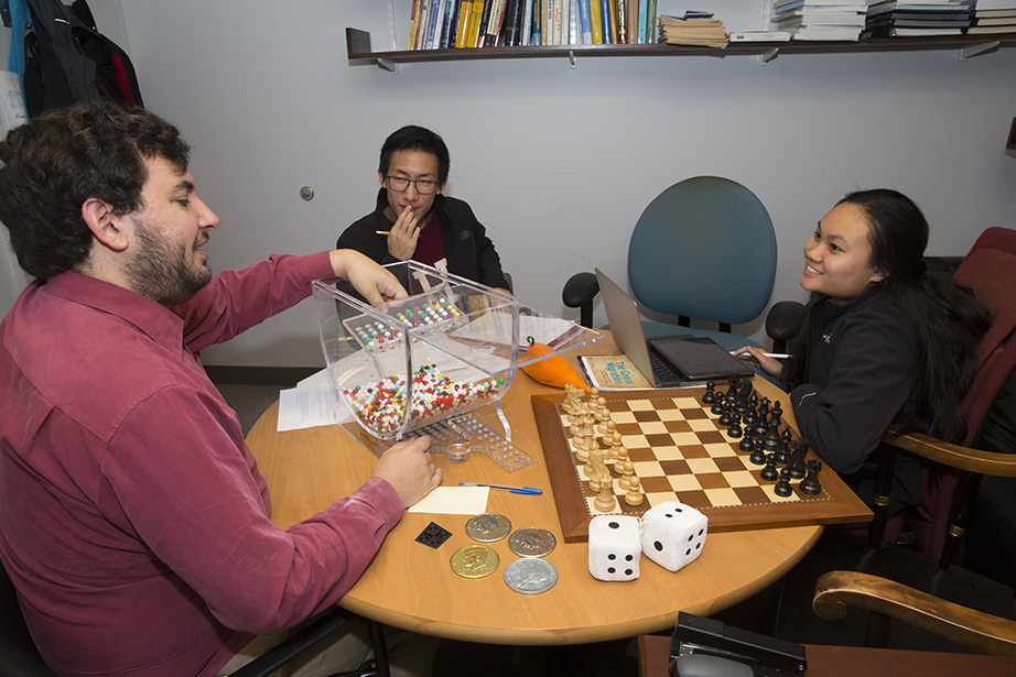 Joe Blitzstein, Professor of the Practice in Statistics, holds office hours with students Caitlyn Dang '20 and Albert Zeng '20.