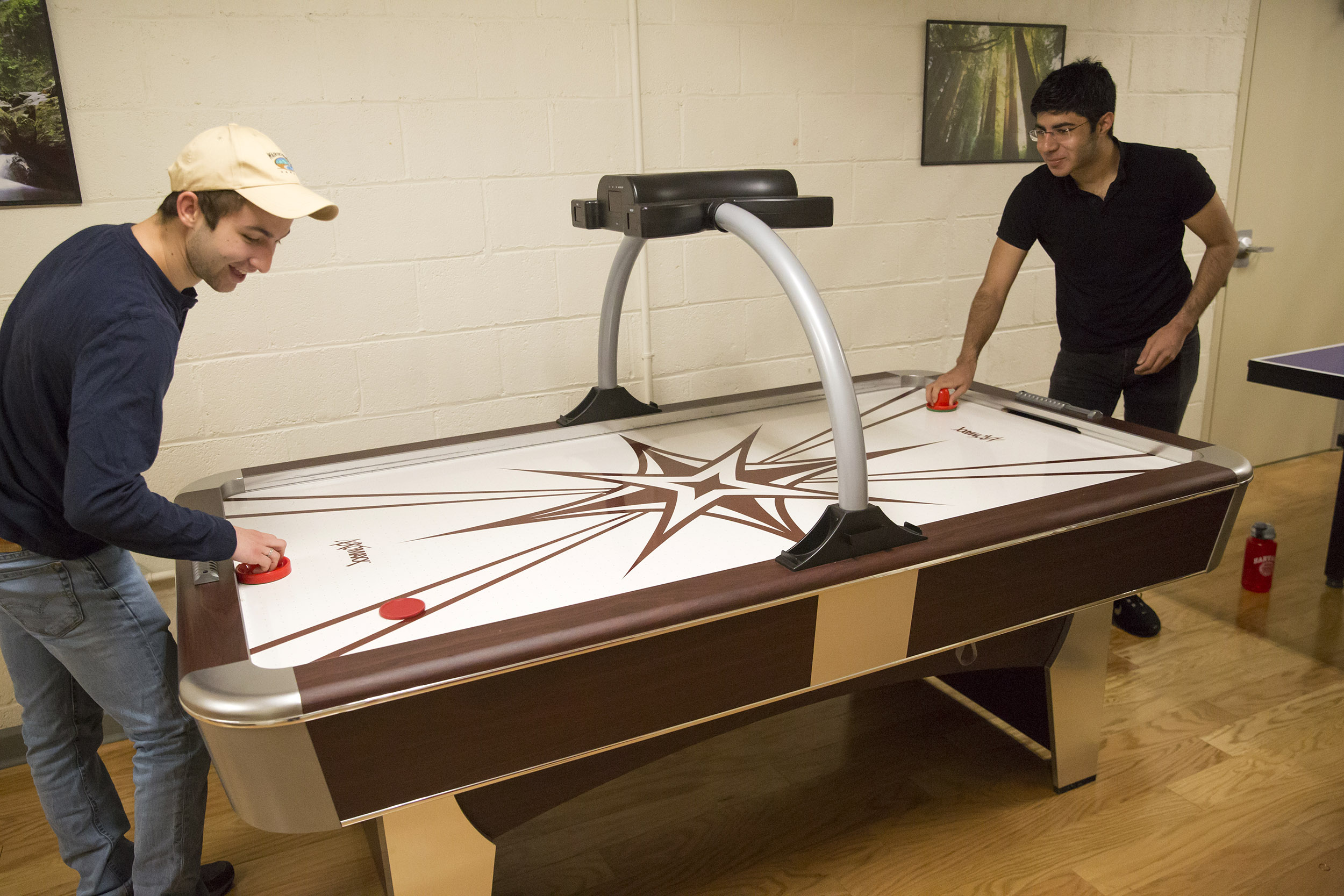 Roommates in Wigglesworth: Scott Kall '20 (MA), left, plays air hockey with Soheil Sadabadi '20 (Iran).