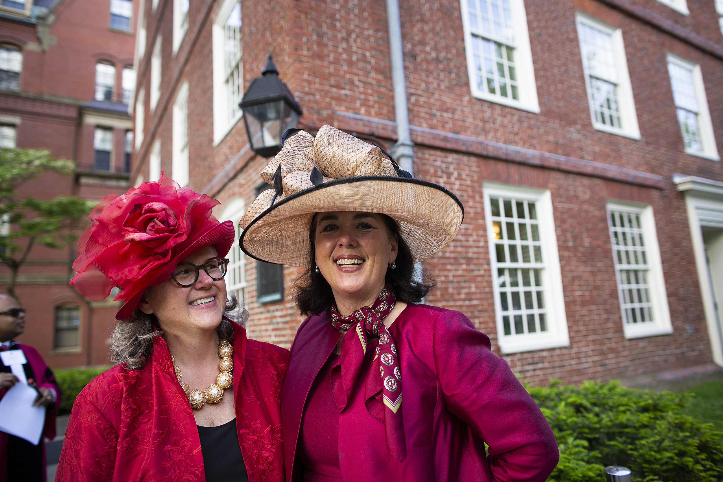 Katie Tiger and Trearty Bartley wear fancy hats at commencement.