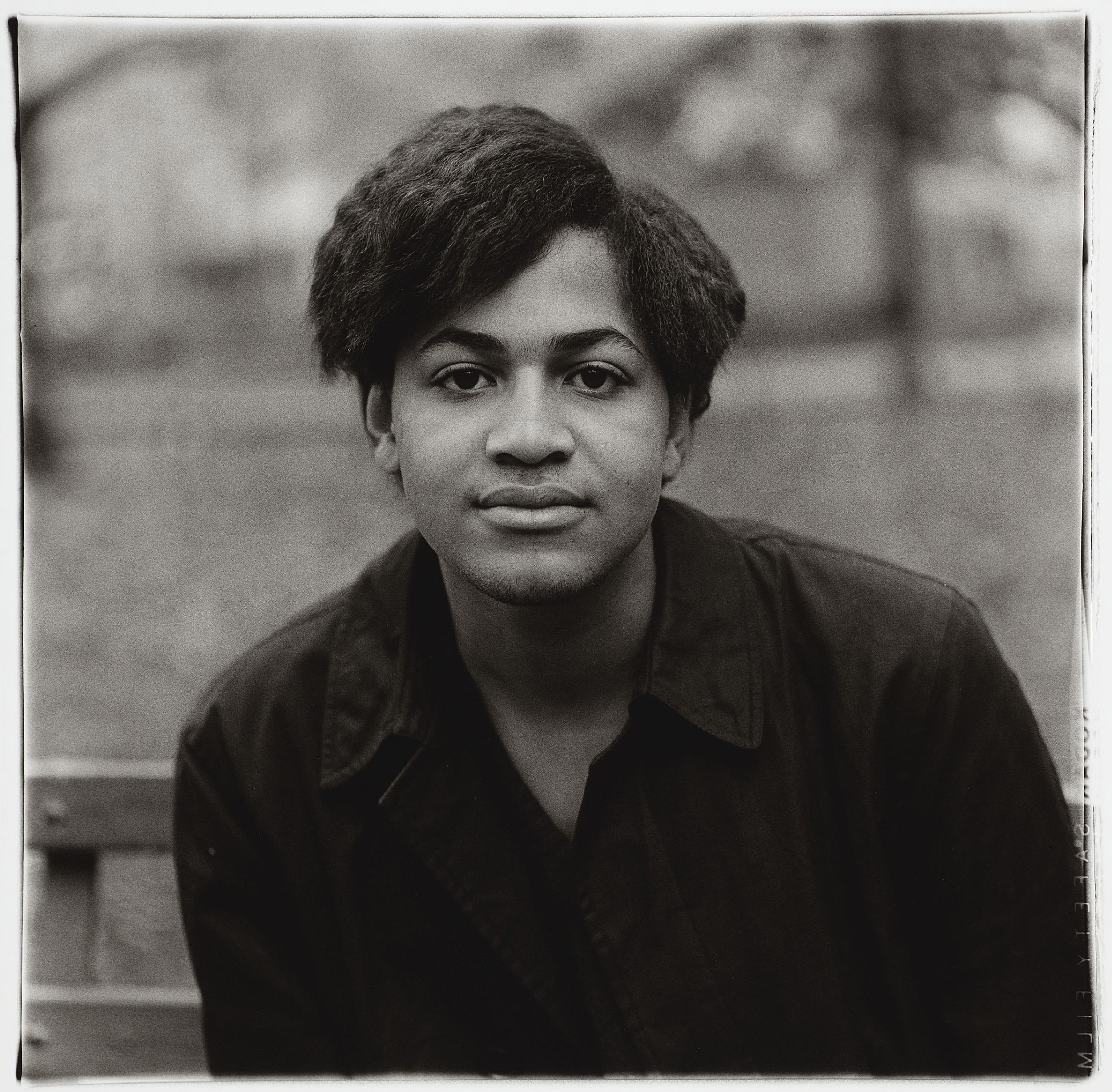 Boy sits in Washington Square Park in 1965.