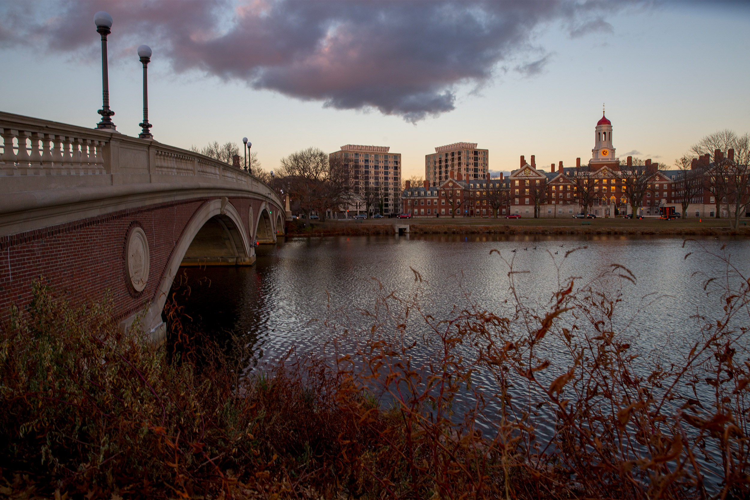 Views at dusk of the Charles River, the Weeks Footbridge,