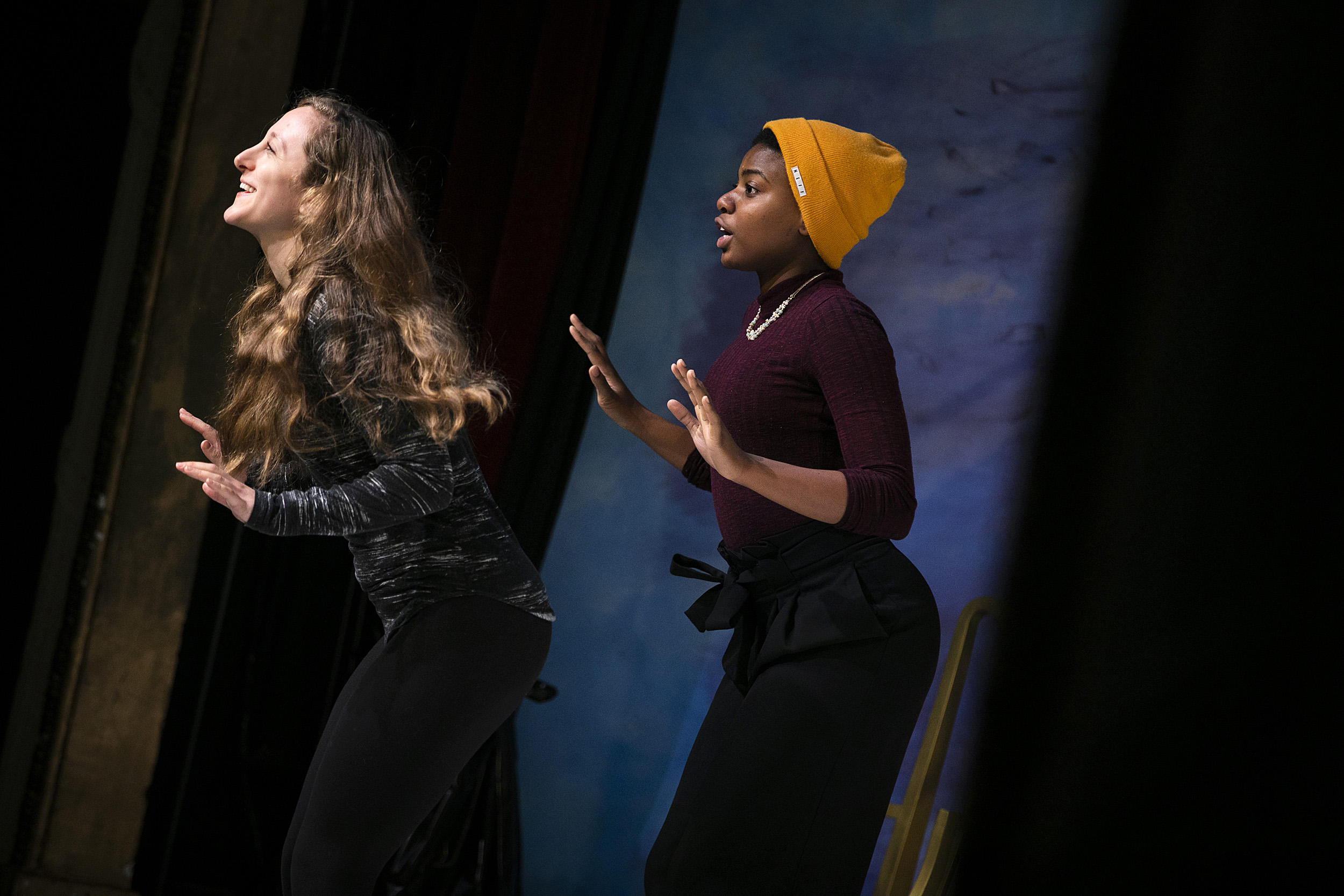 two women on stage with jazz hands