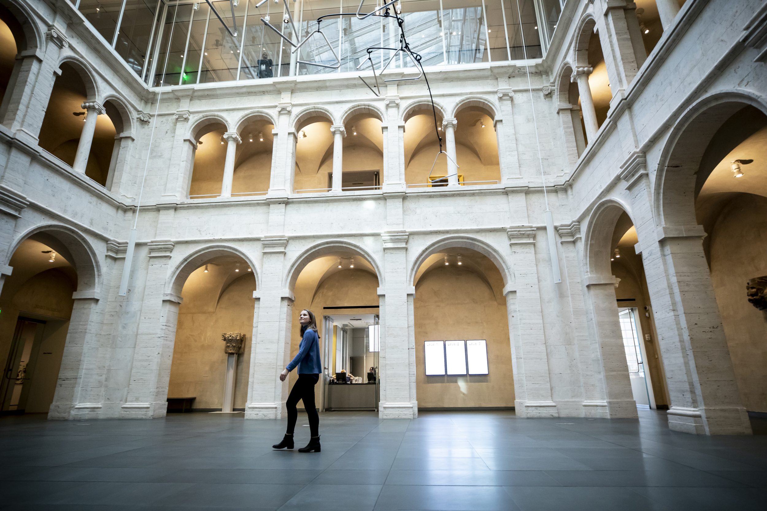 A student walking in the Harvard Art Museums