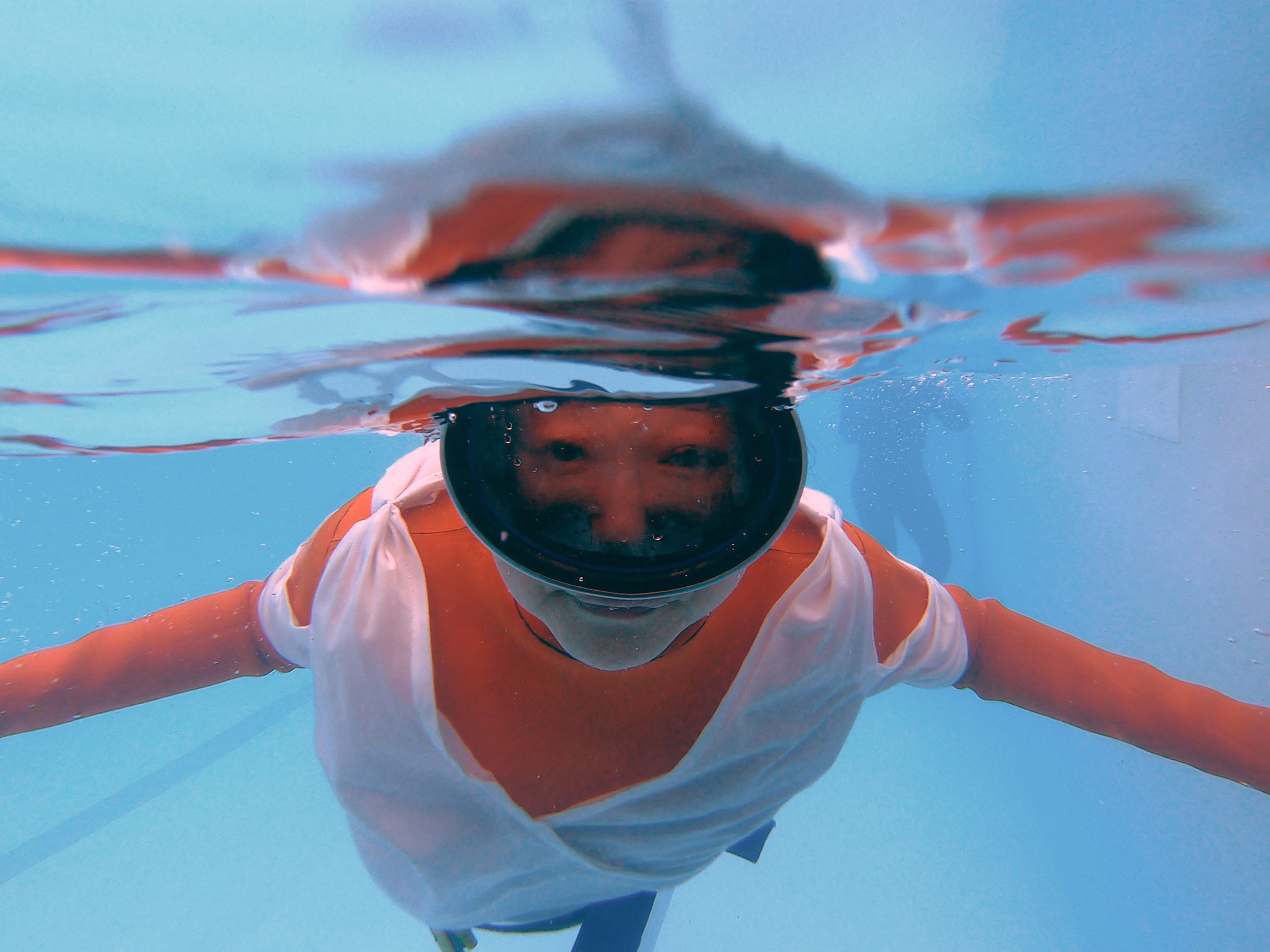 Jo Yang in rehearsal, diving underwater.