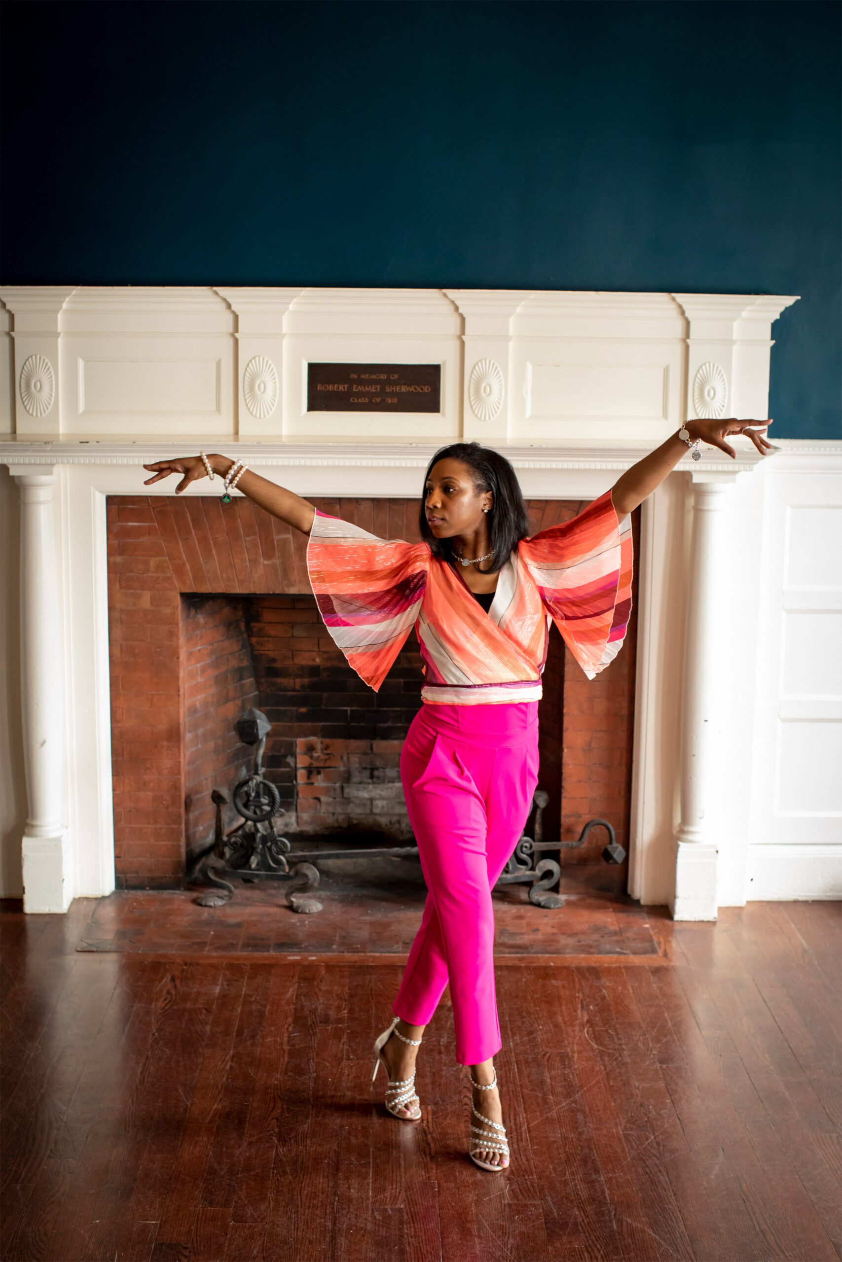 Jackson in a dance pose in front of a fire place