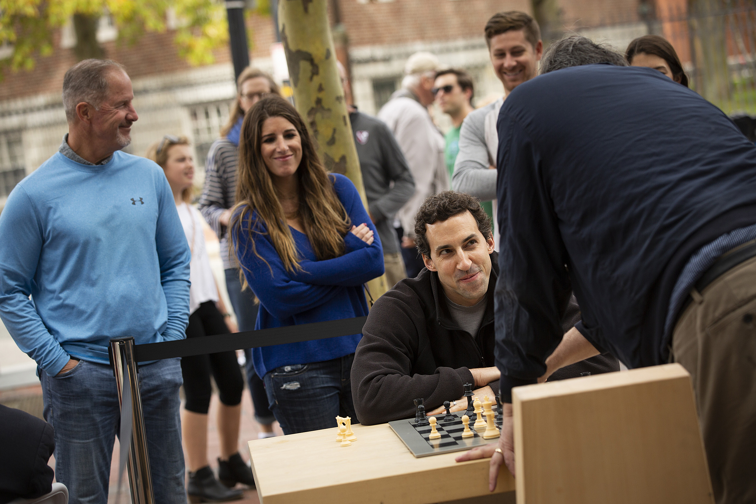 Two people playing chess outside the Smith Center