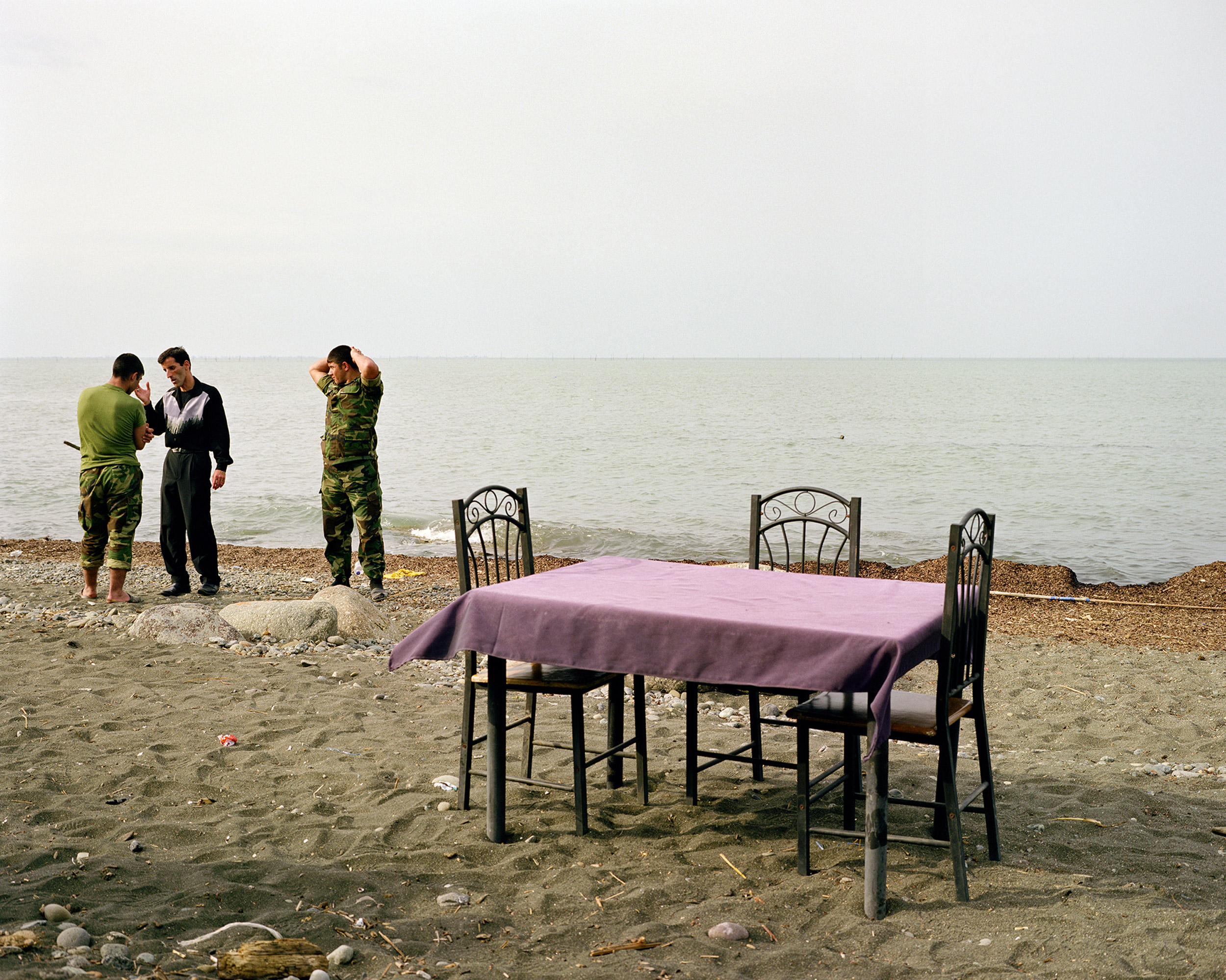 Beach cafe with soldiers.