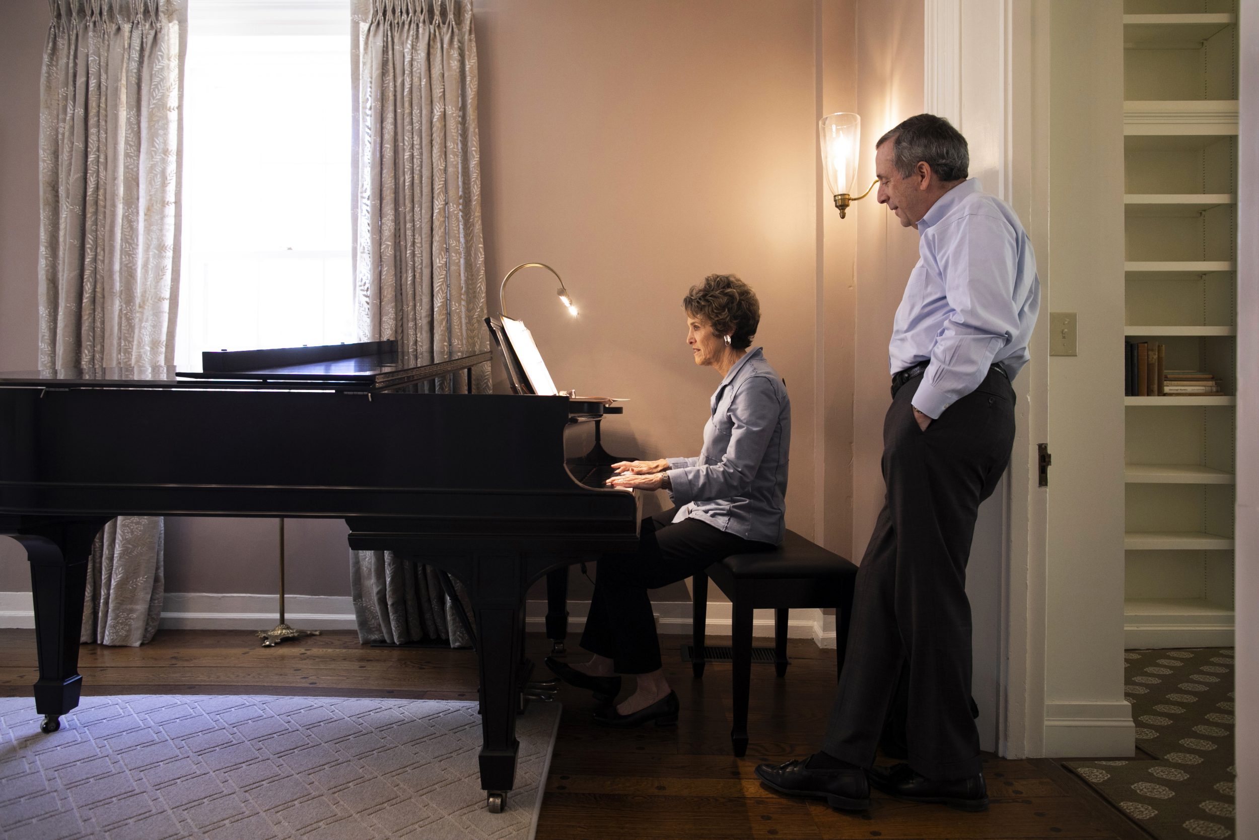 Adele Fleet Bacow playing the piano for husband, Larry Bacow.