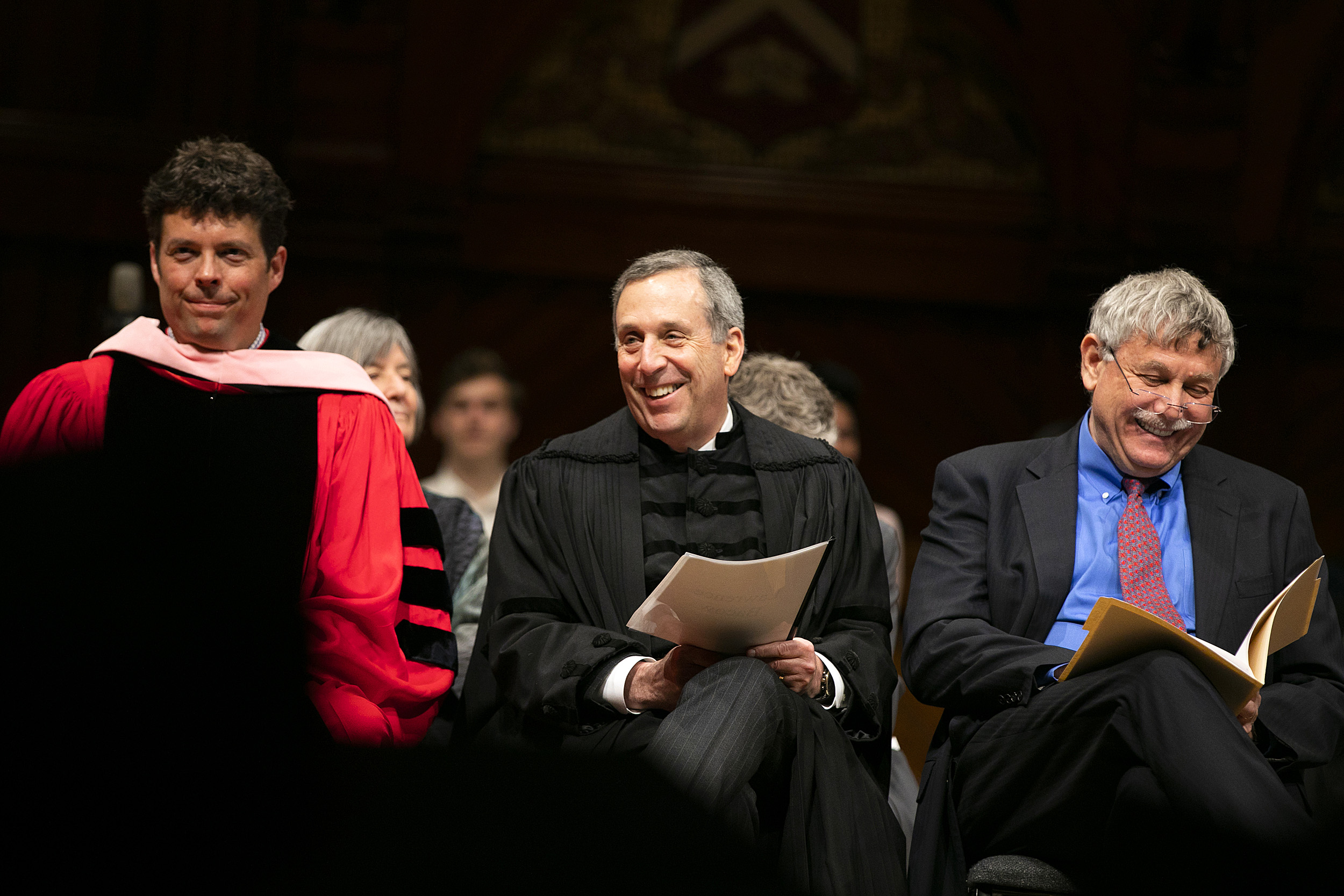 Director of Choral Activities and Senior Lecturer on Music Andrew Clark (from left), University President Larry Bacow, and Eric Lander sitting together.