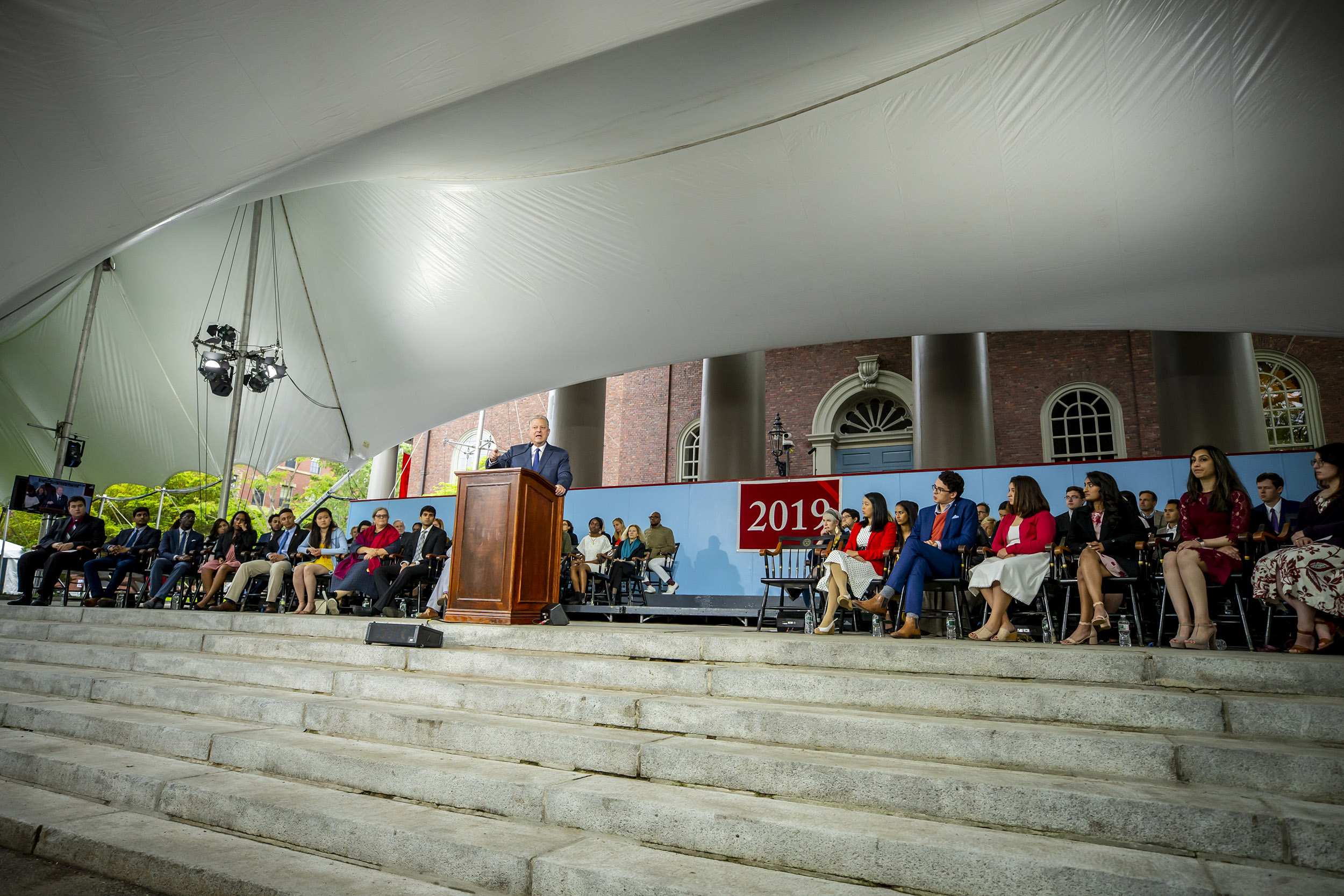 Al Gore speaks from podium during Class Day.