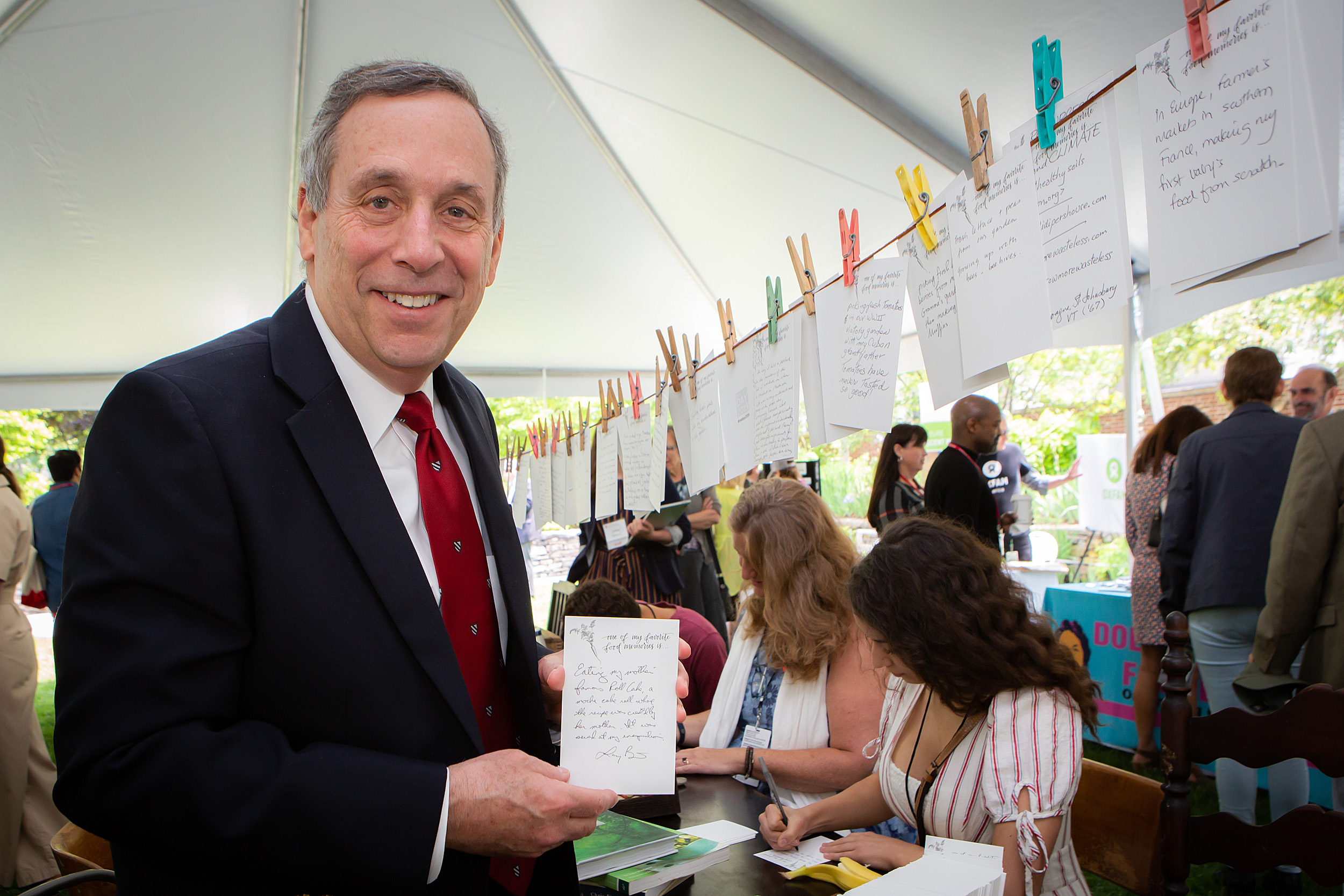 Larry Bacow holds his food memory card.