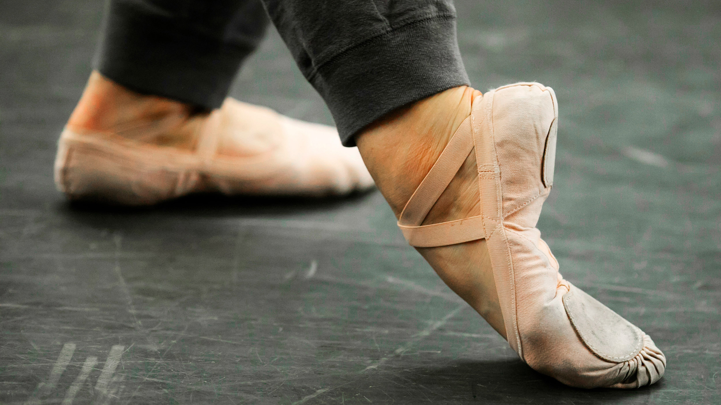 Feet of a dancer in the “B-Plus” position.