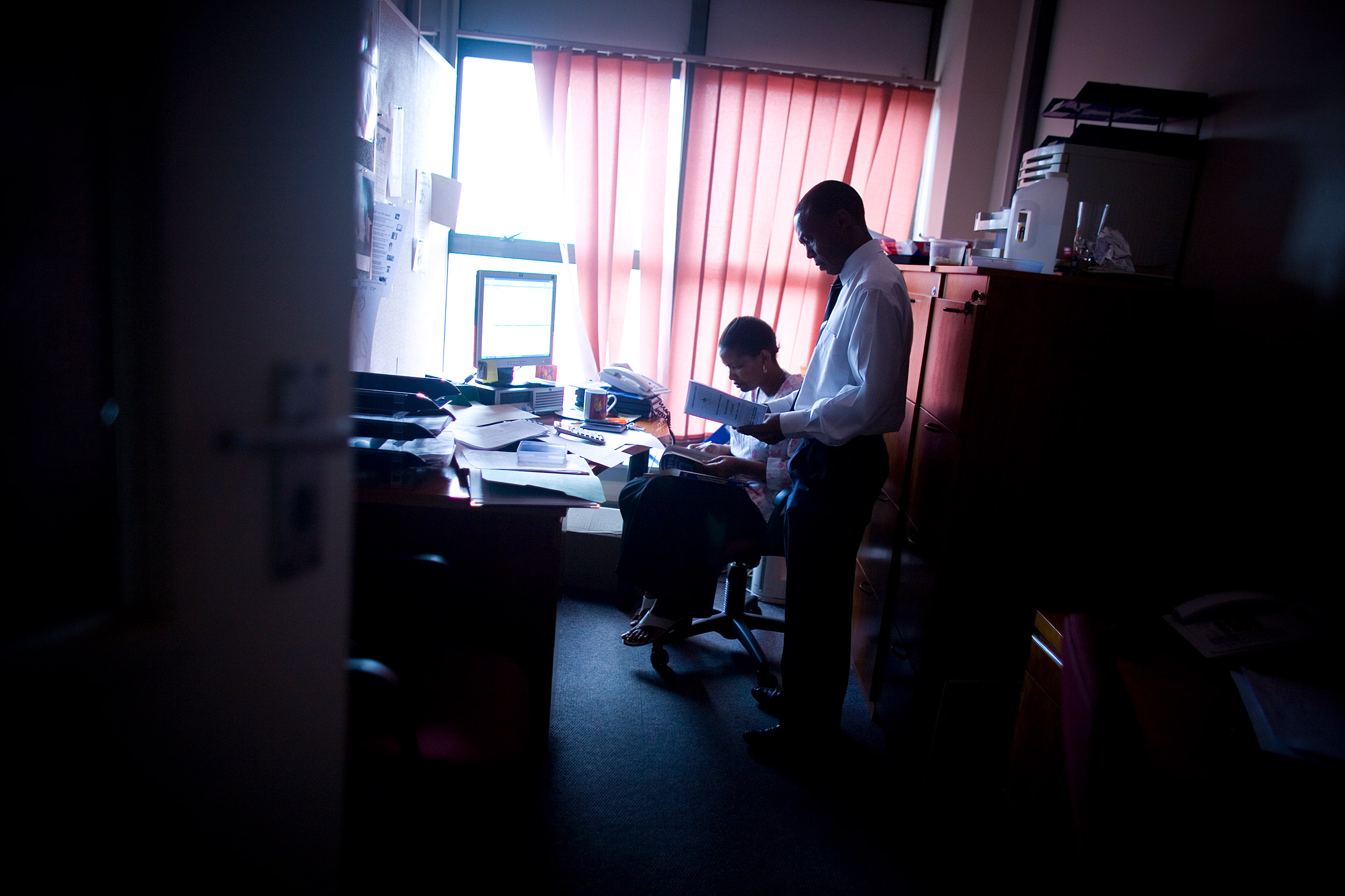 Joseph Makhema speaks with an assistant at the Botswana-Harvard HIV Reference Laboratory in Gaborone, Botswana.