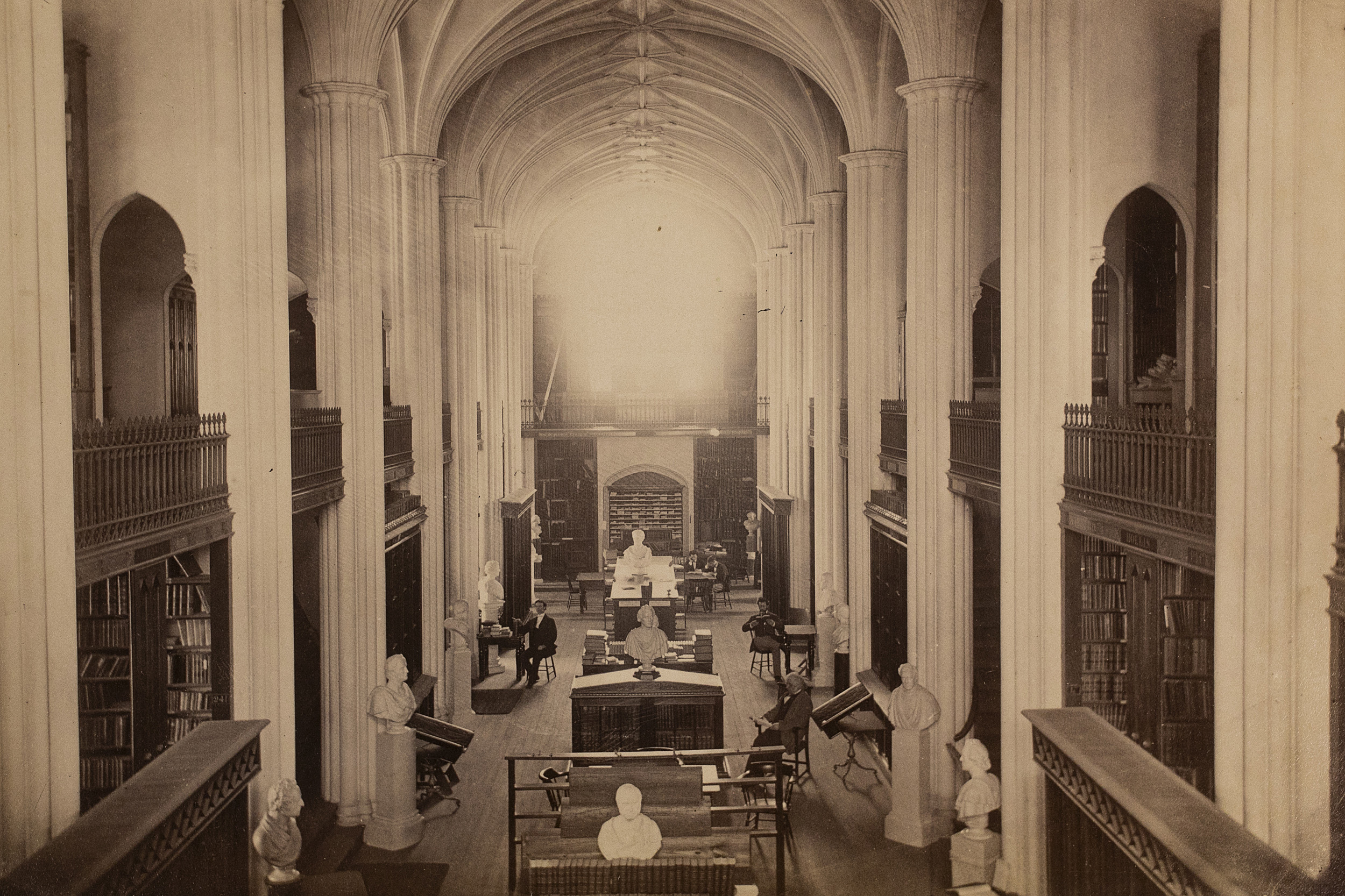 Inside Gore Library, columns and arches resemble church cathedral.