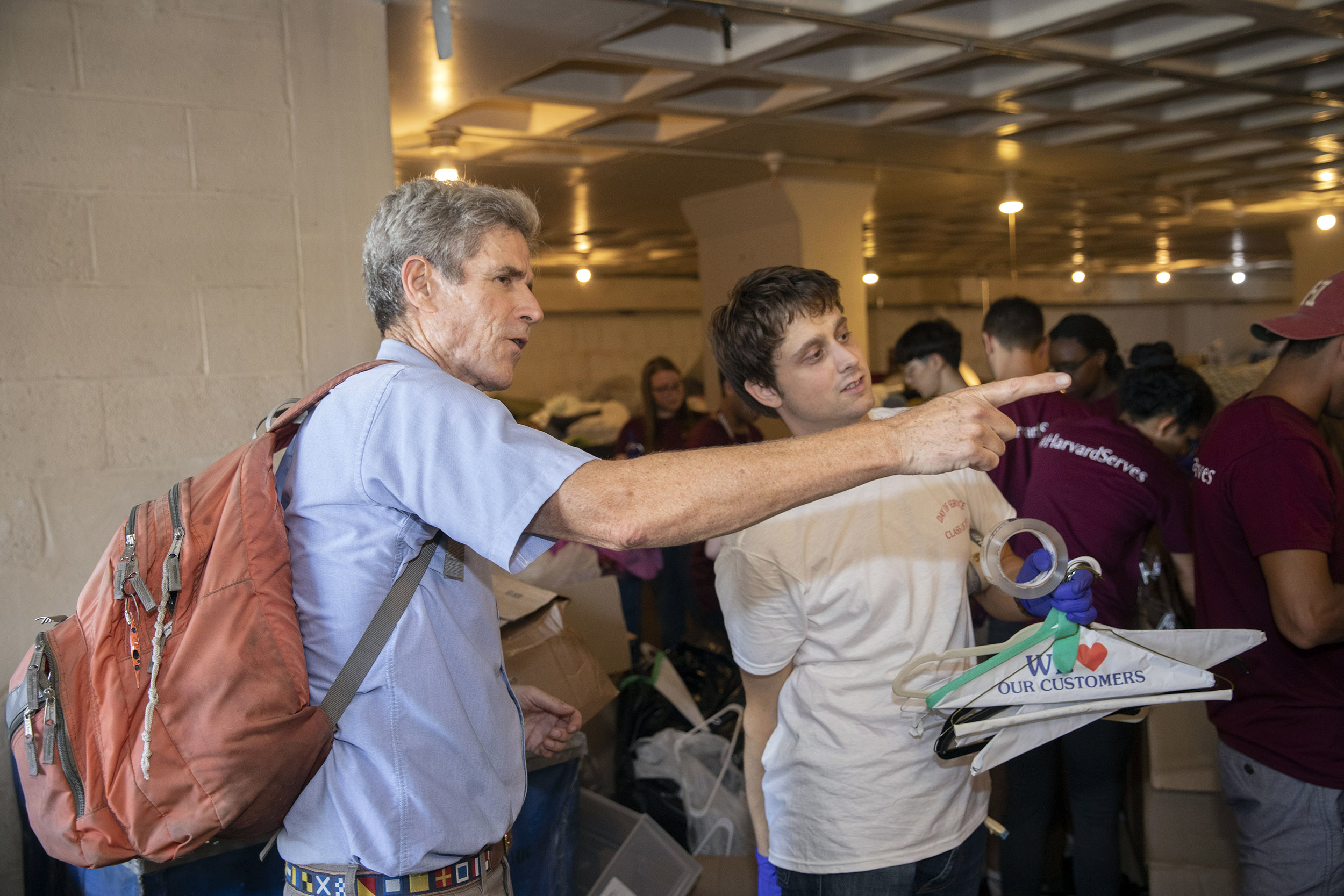 A man gives directions to assistant