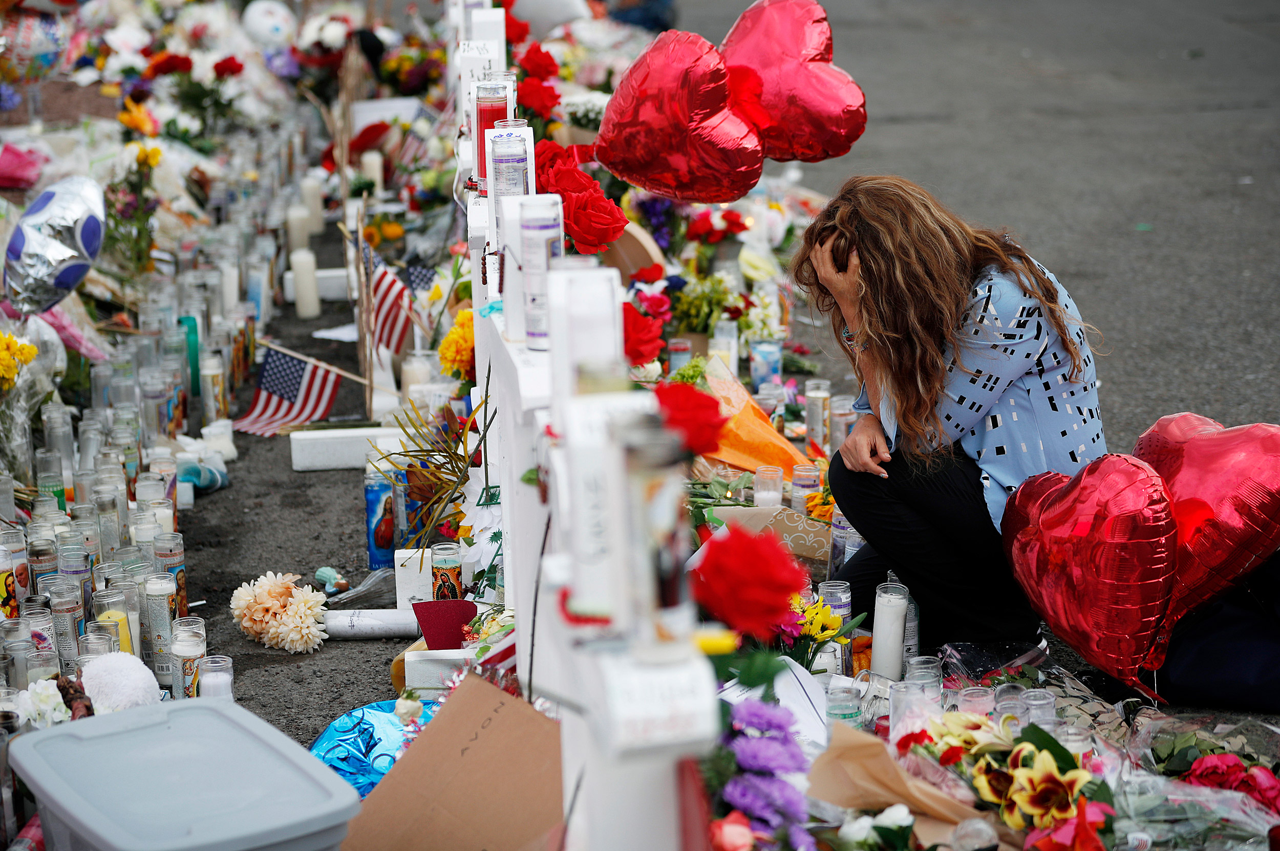 Woman mourns at memorial