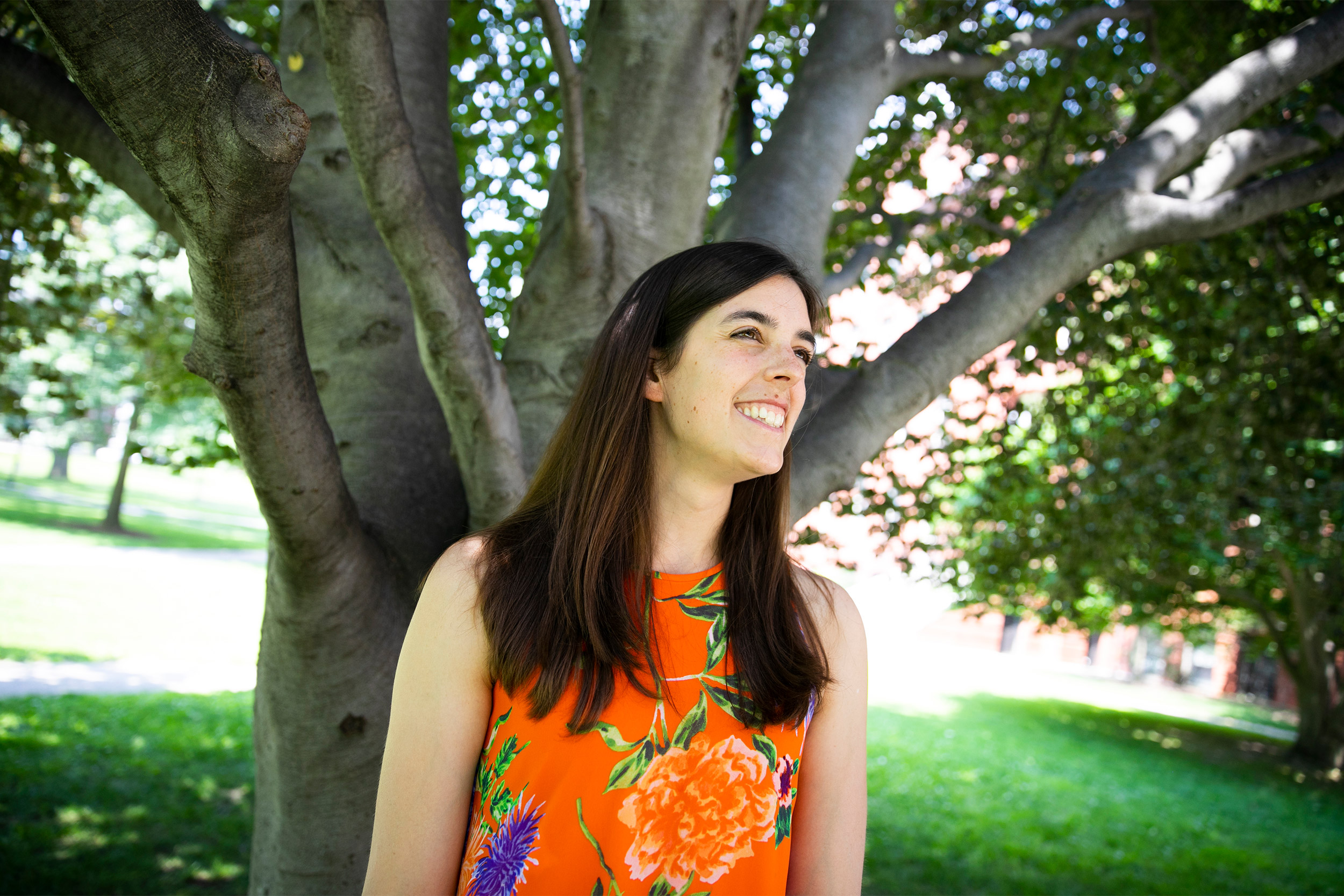 Dakota McCoy outside by a tree.