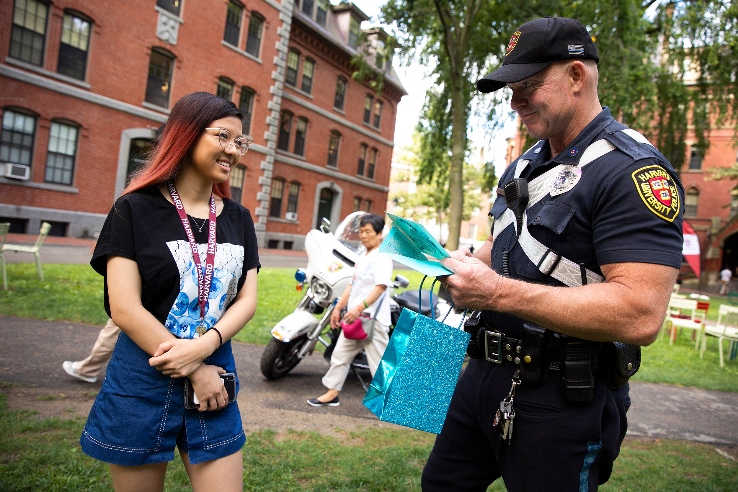 Officer talking to student.