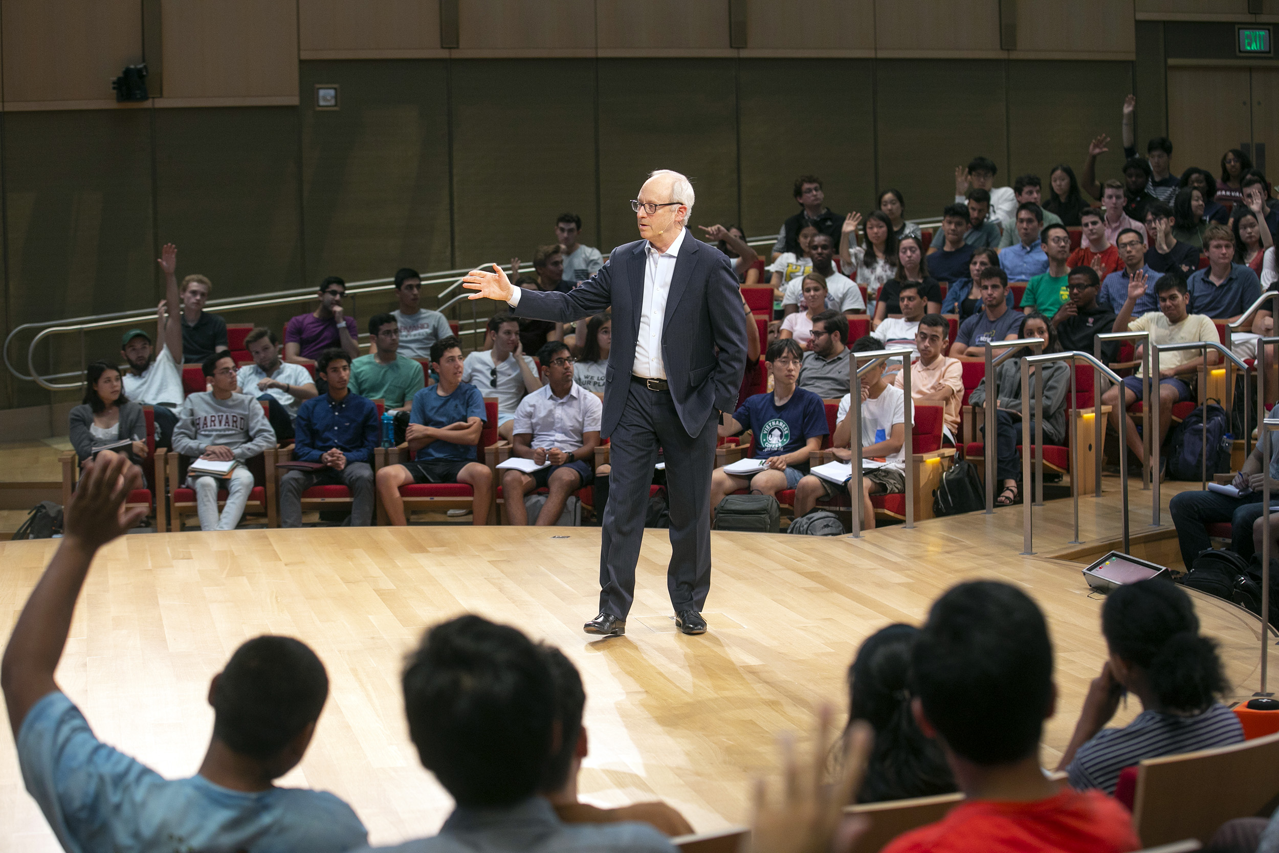 Michael Sandel speaks from the stage during class.