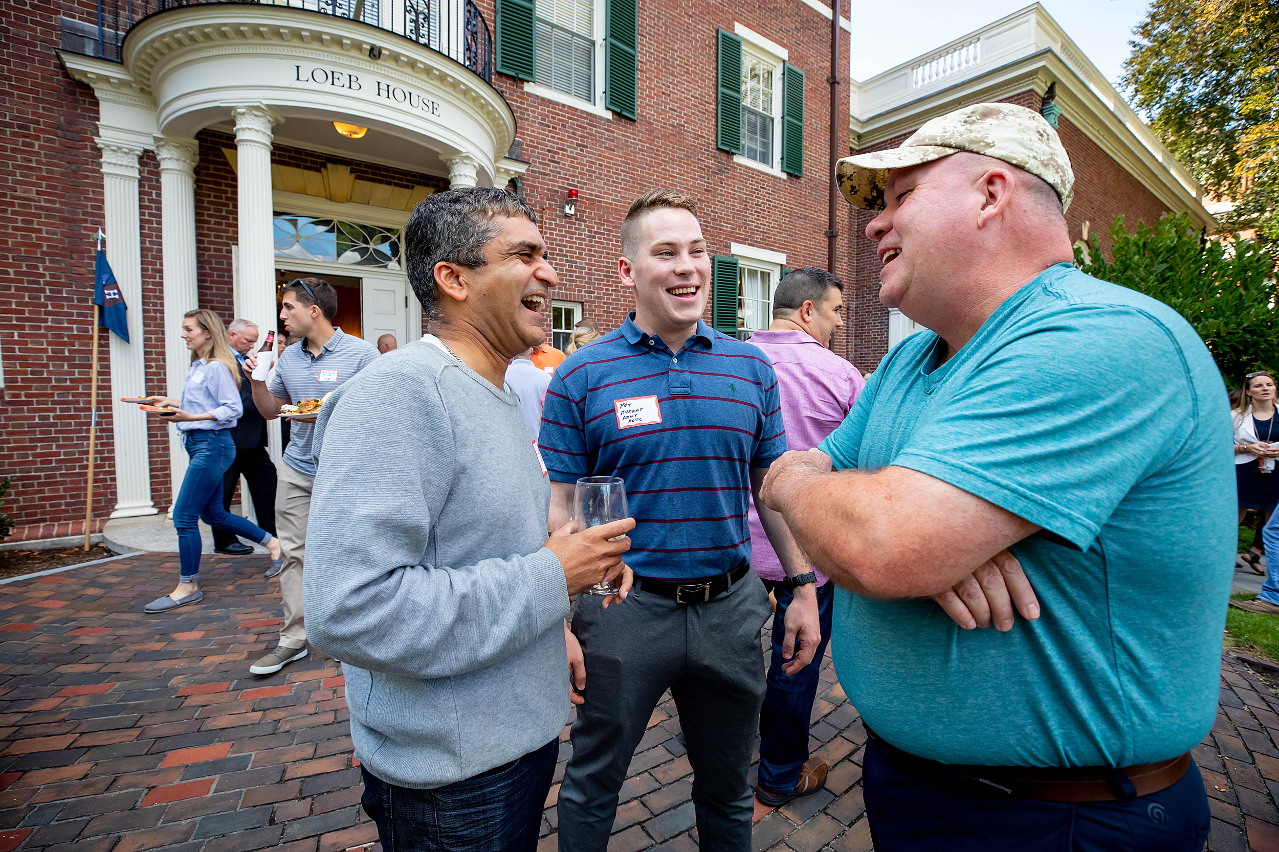 Father with sons in ROTC and the military talks with Harvard College dean.