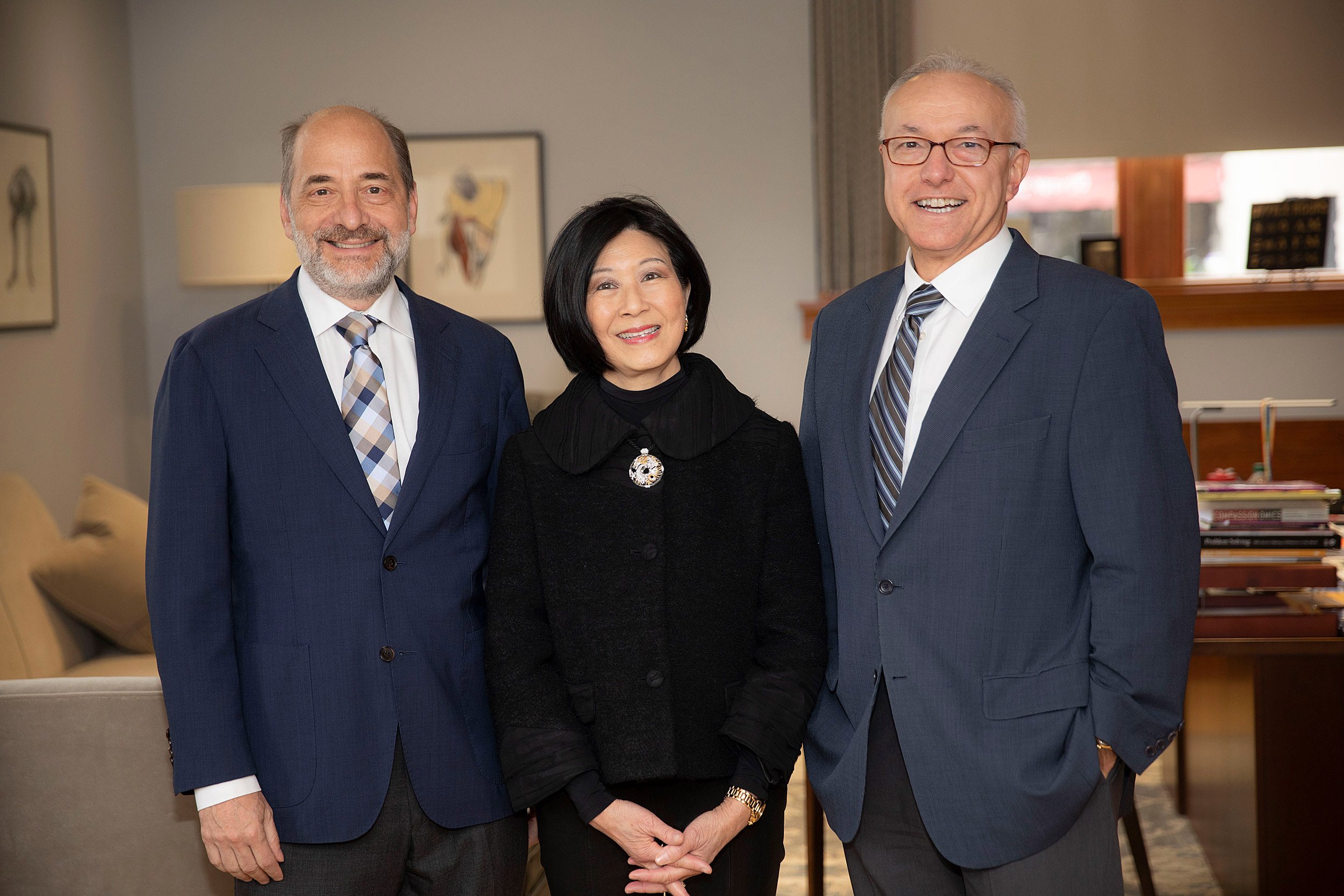 Professor Mike Greenberg, (from left) Lisa Yang, and Dean George Daley meet in Gordon Hall.