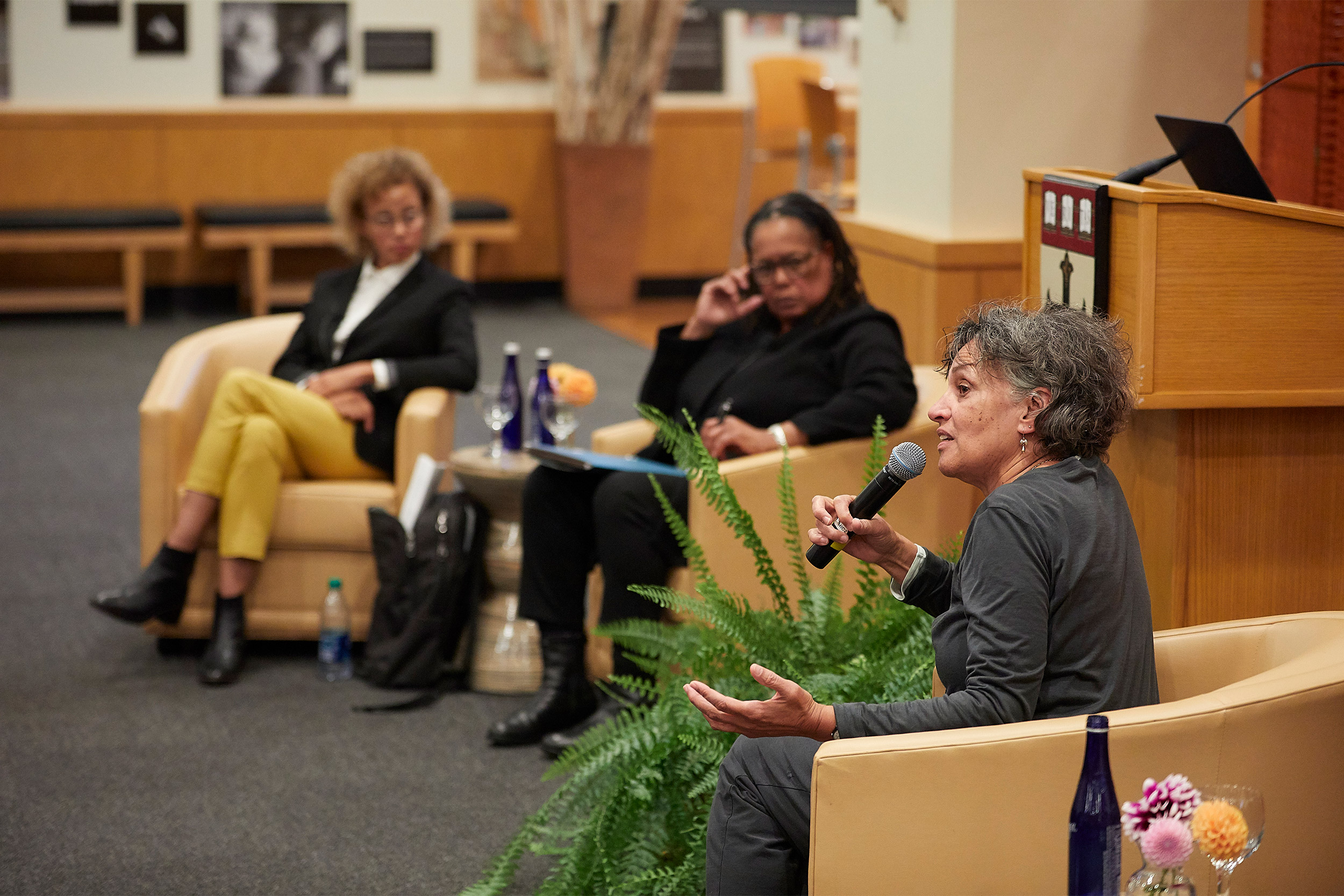 Mary Bassett speaks into a microphone during a panel discussion