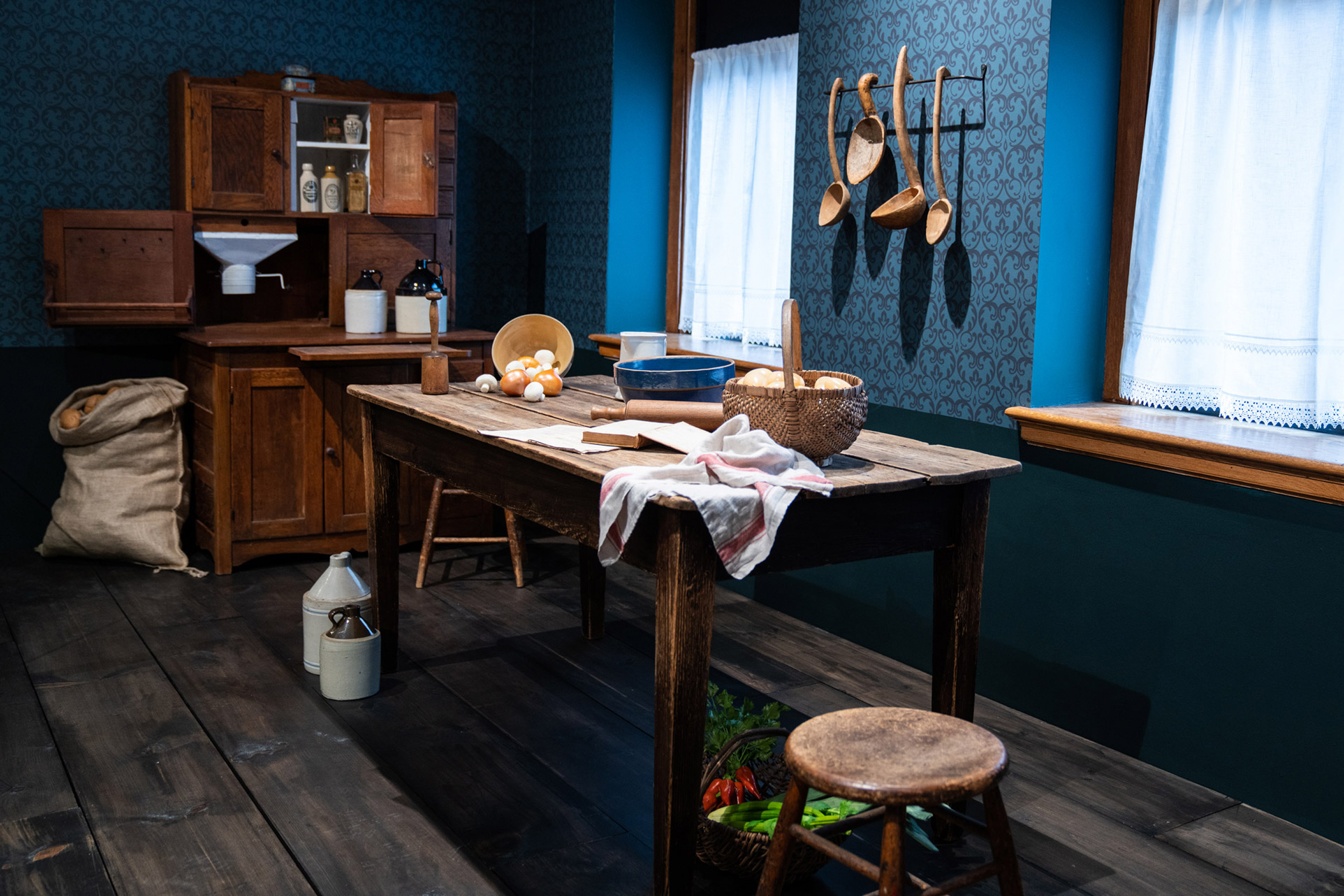 Gallery view of an early 20th-century home kitchen.