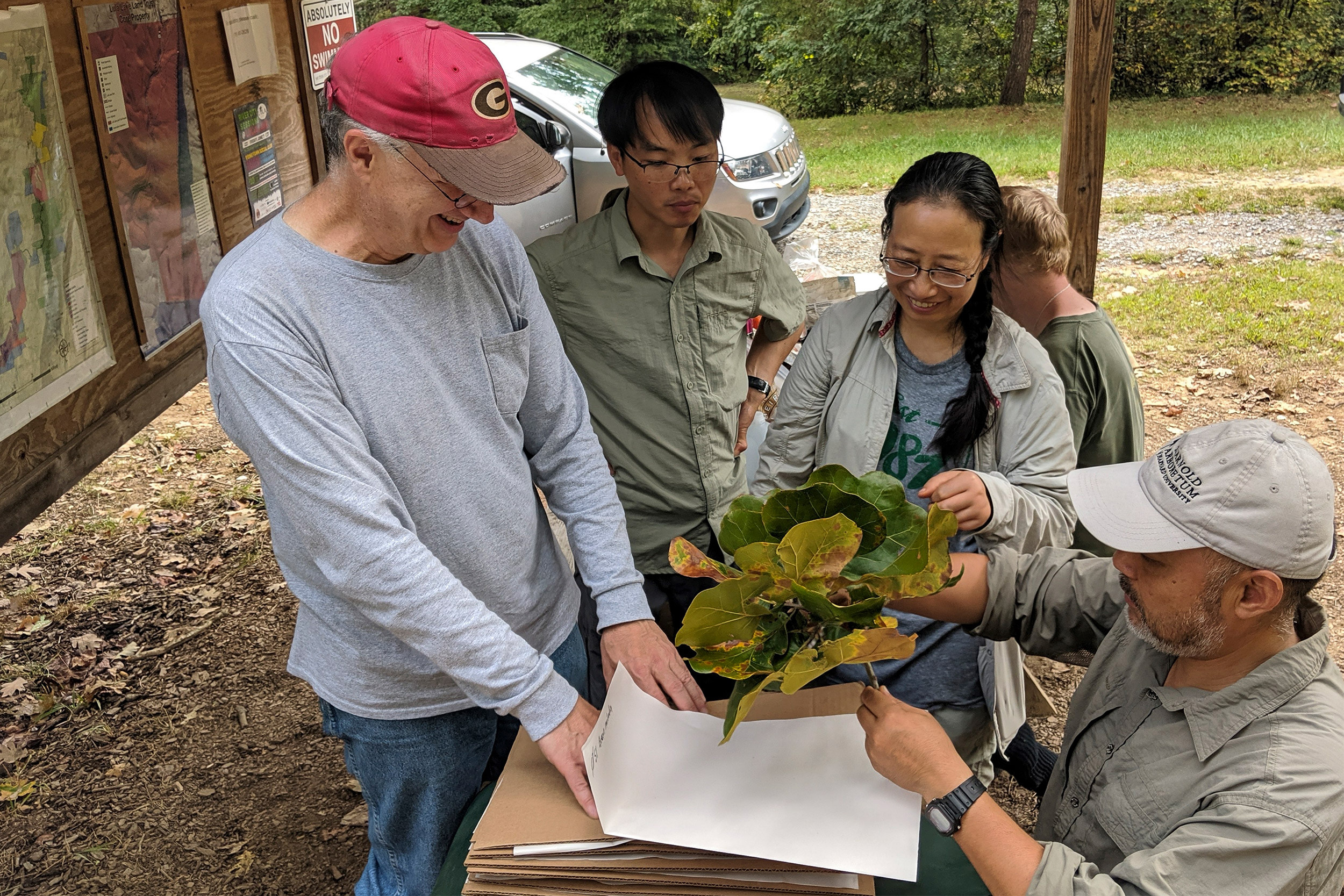 Four people collecting specimens.