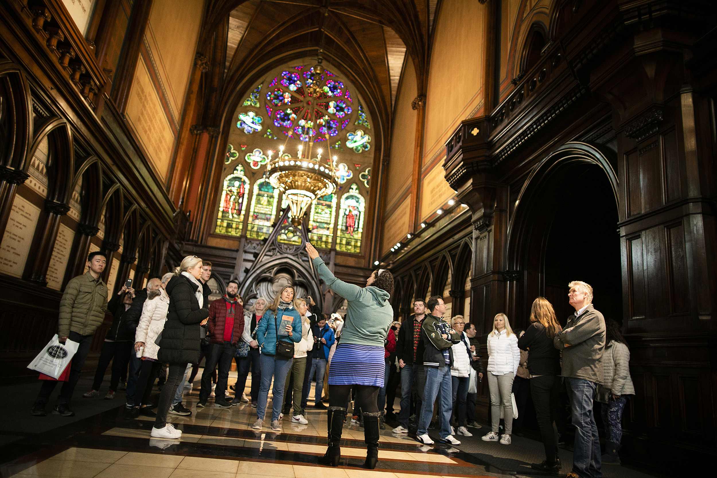 Rachel Gilchrist shows the group Memorial Hall.