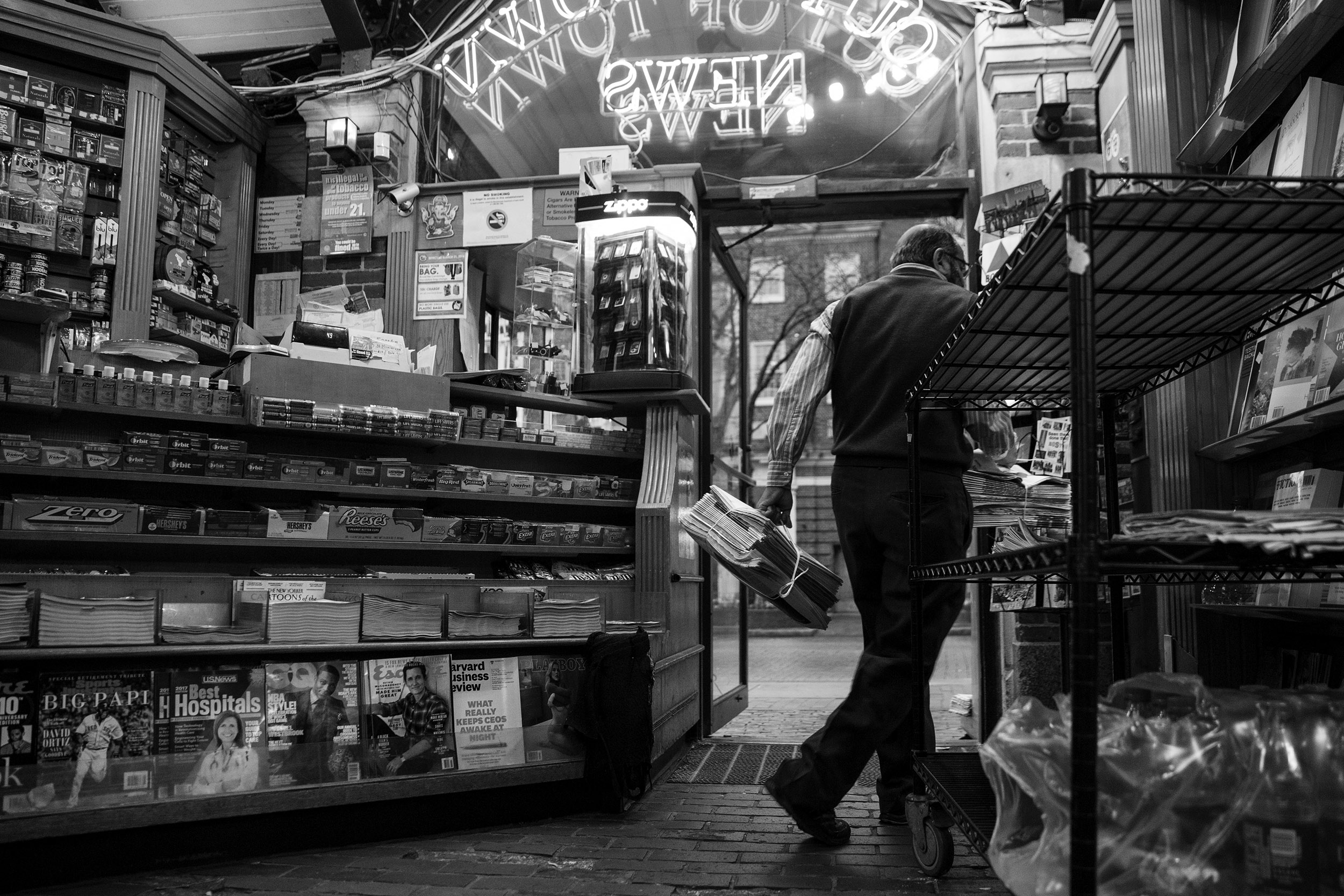 Mohamed Rahman unloads newspapers from around the world inside Out of Town News.