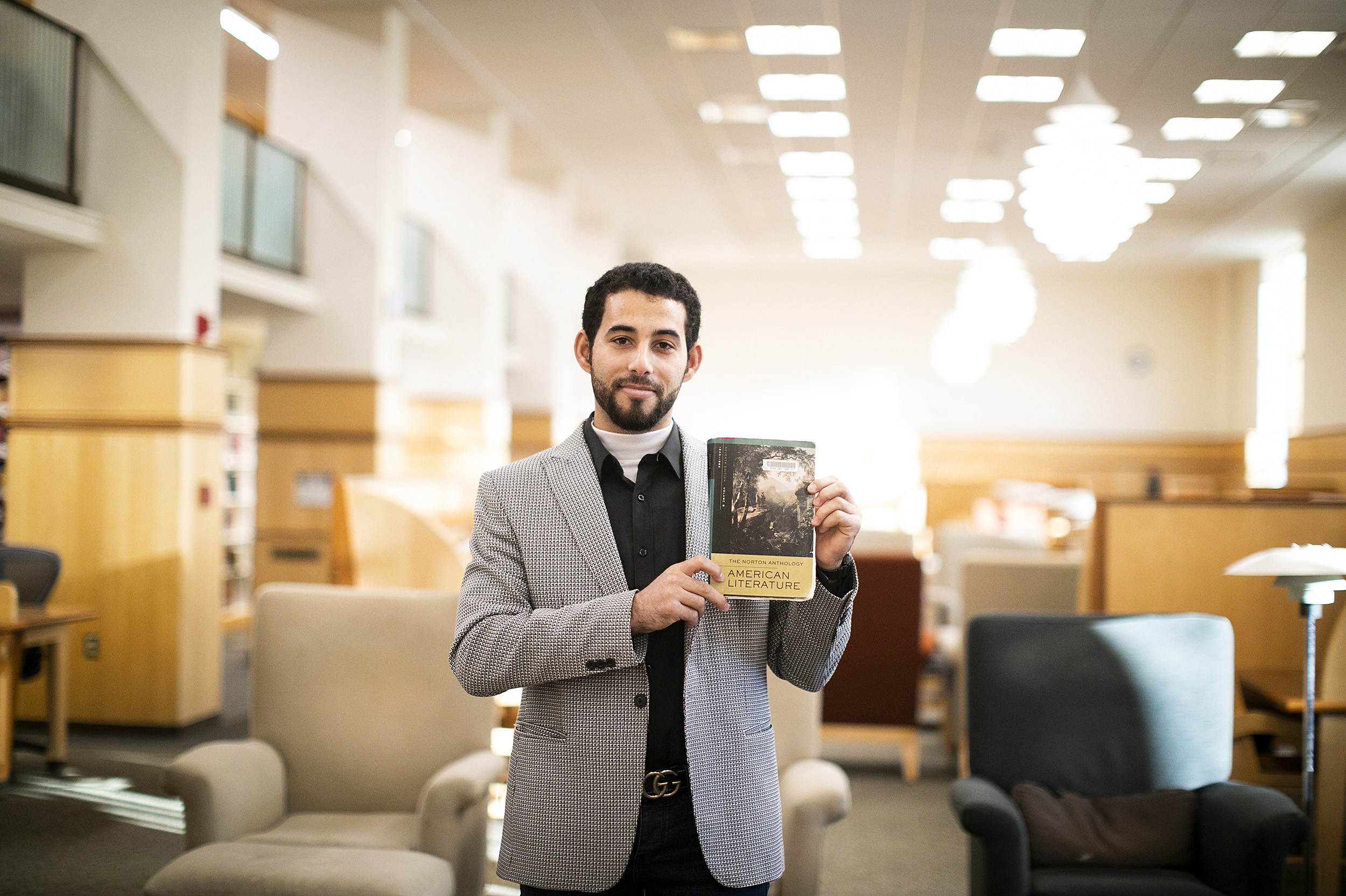 Mosab Abu Toha holding a book.