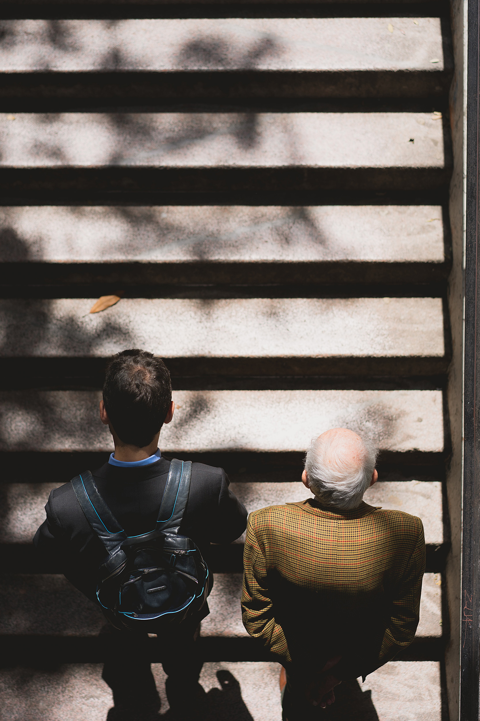 Two people going up stairs.