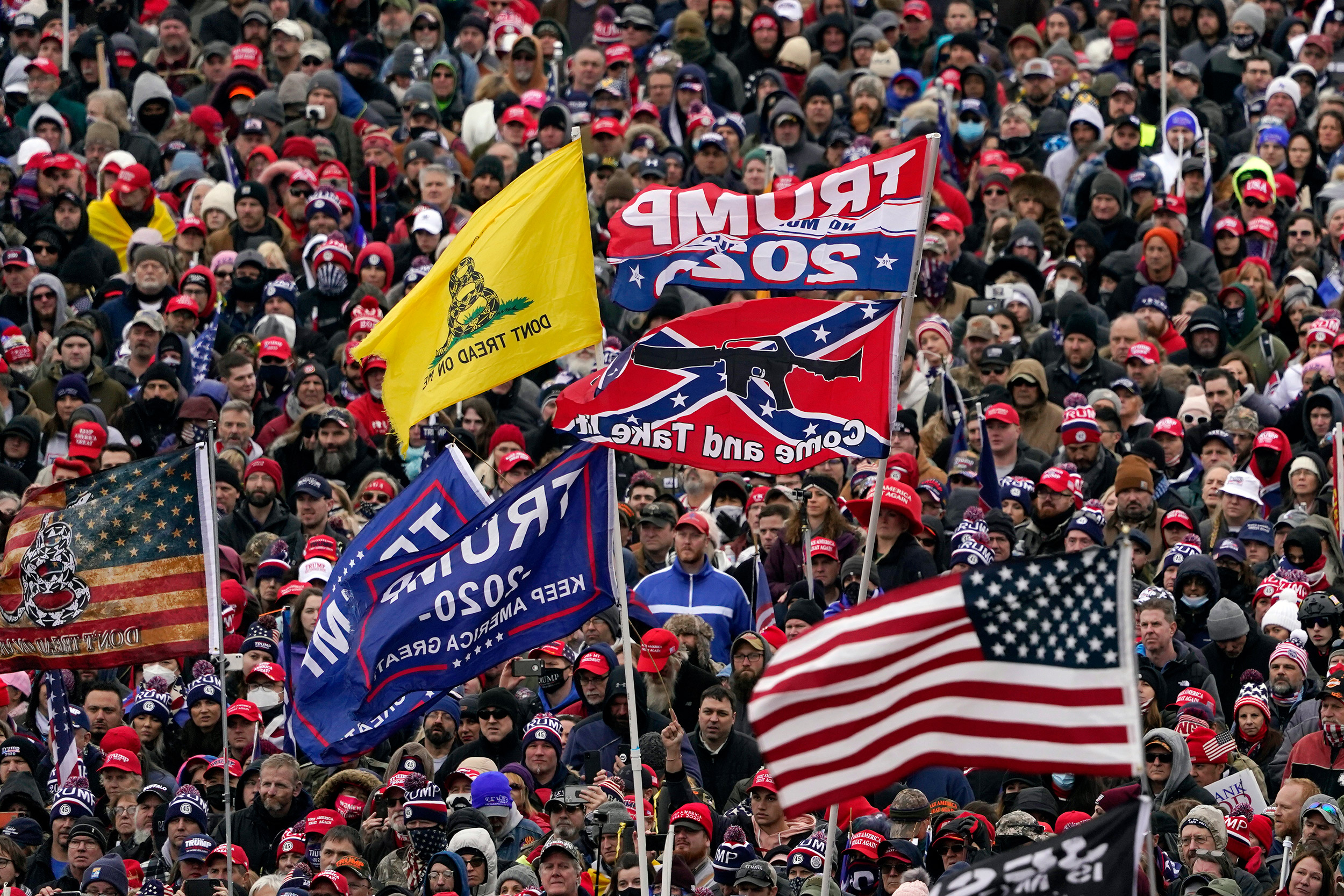 Jan. 6, 2021, file photo, supporters listen as President Donald Trump speaks.