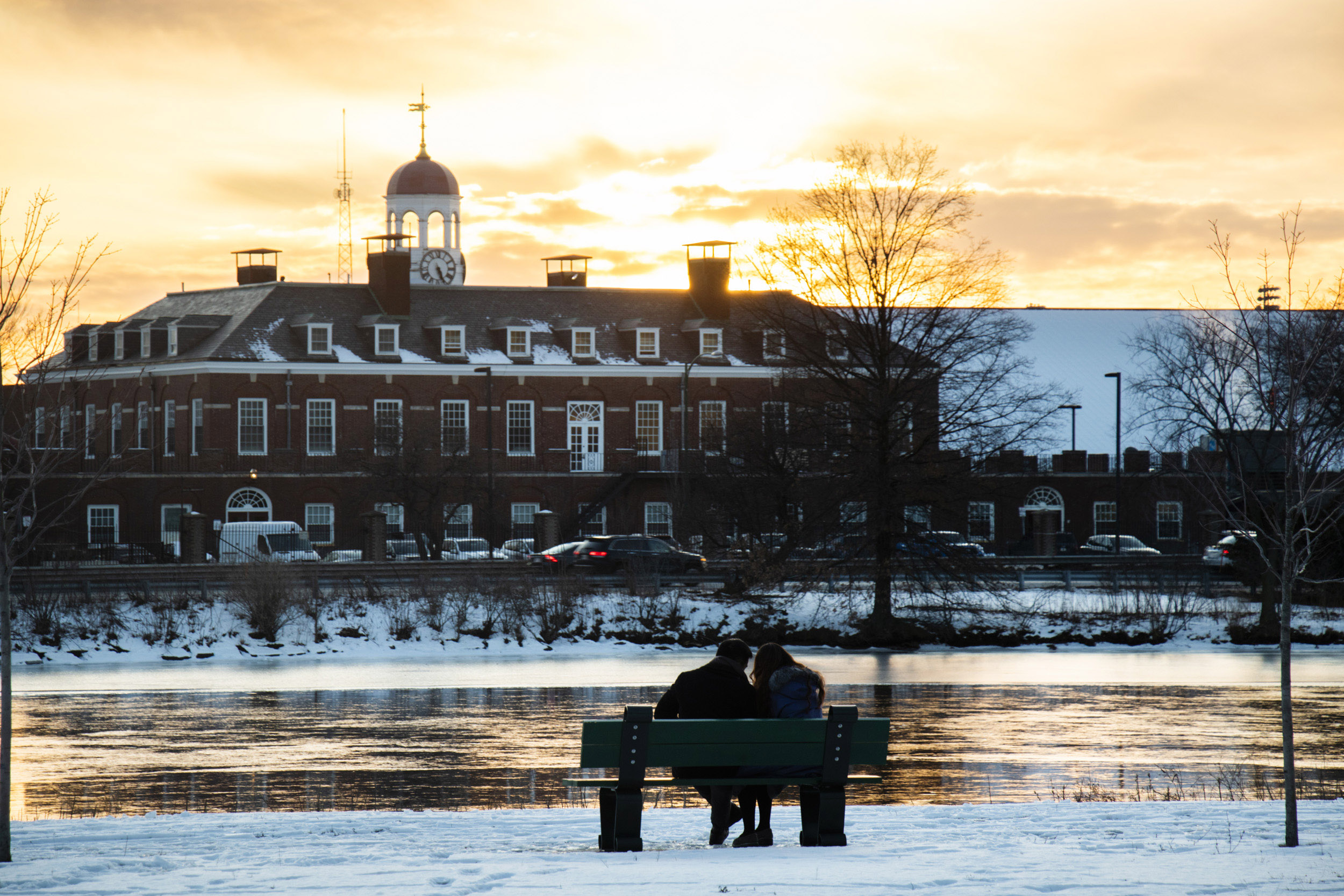 Sunset with snow and ice on the river.