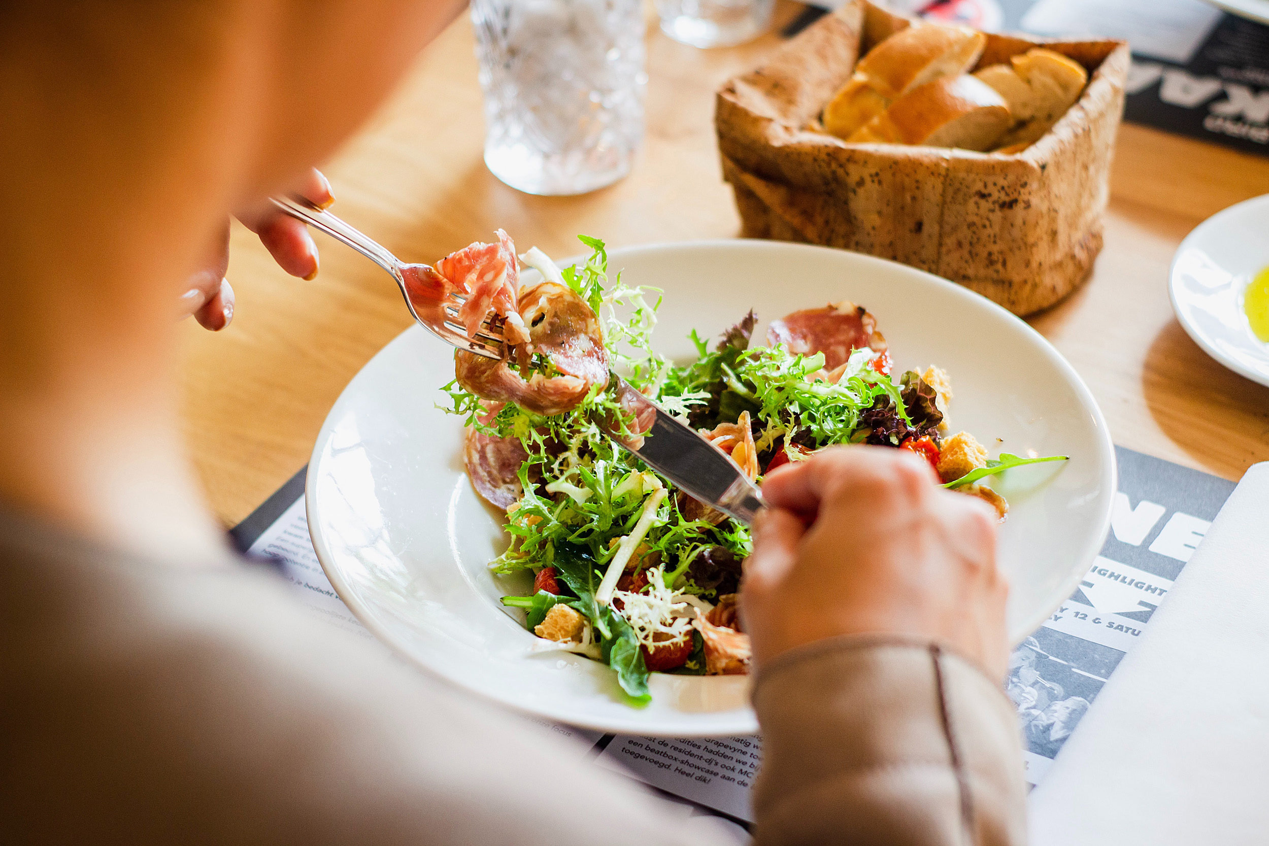 Person eating salad.