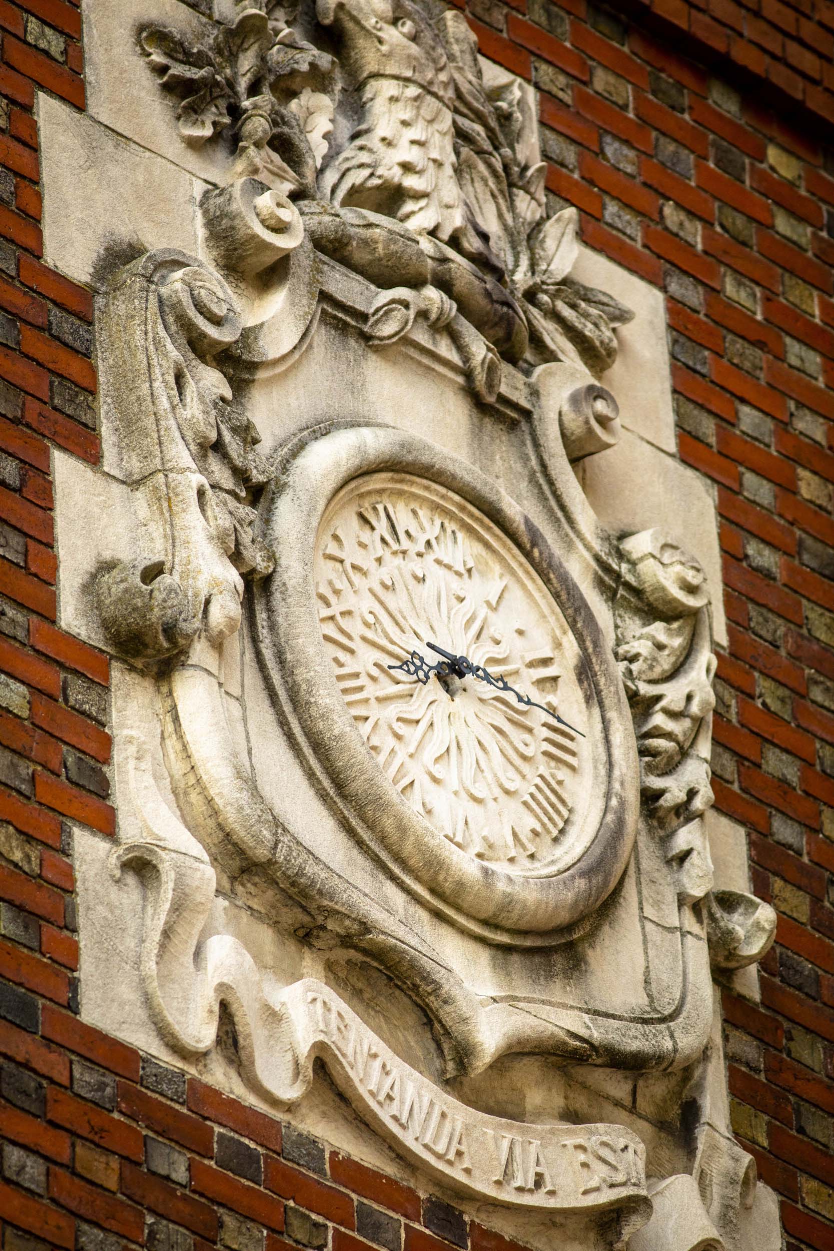 An elaborate clock is pictured on Adams House.