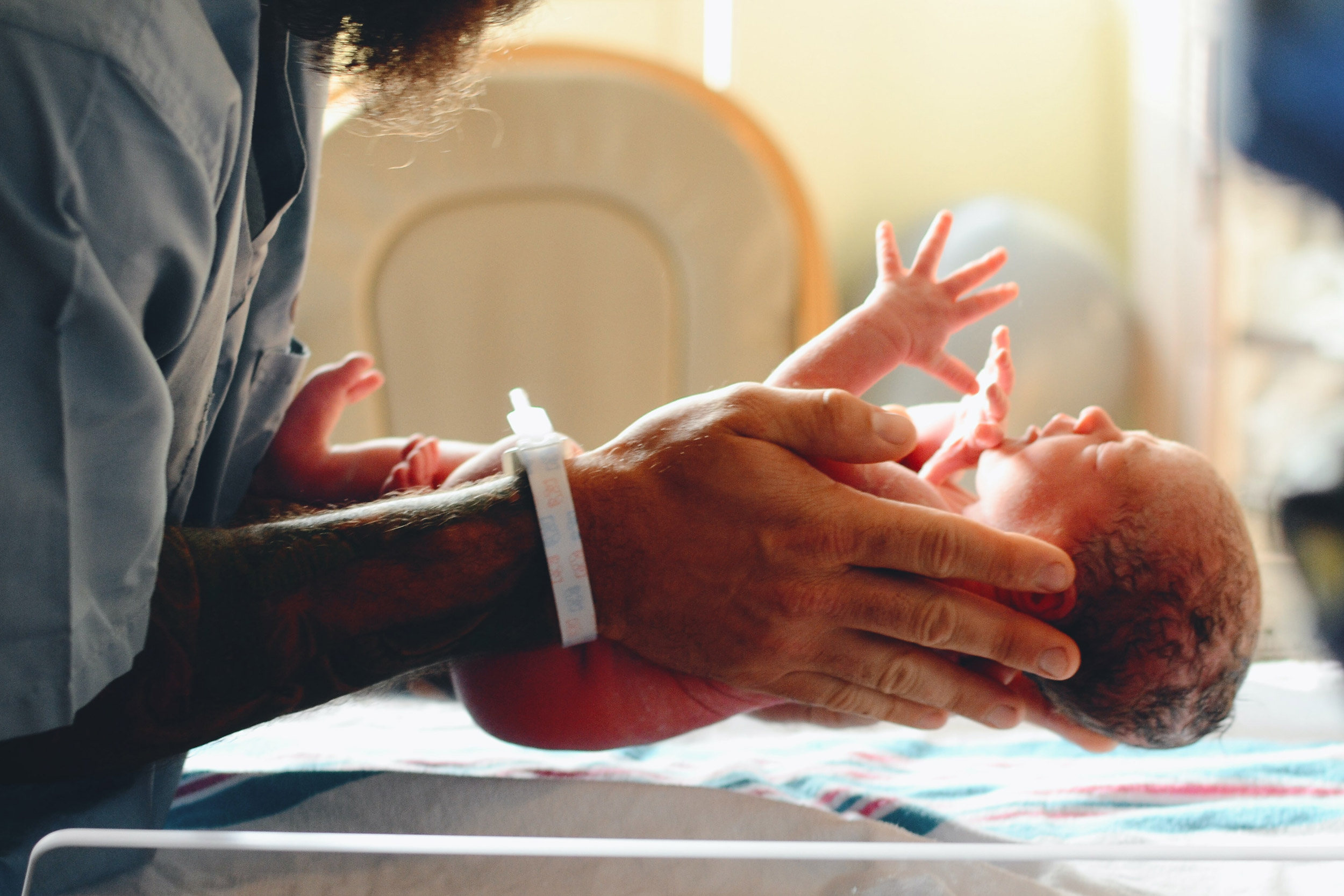 INfant in doctor's hands.