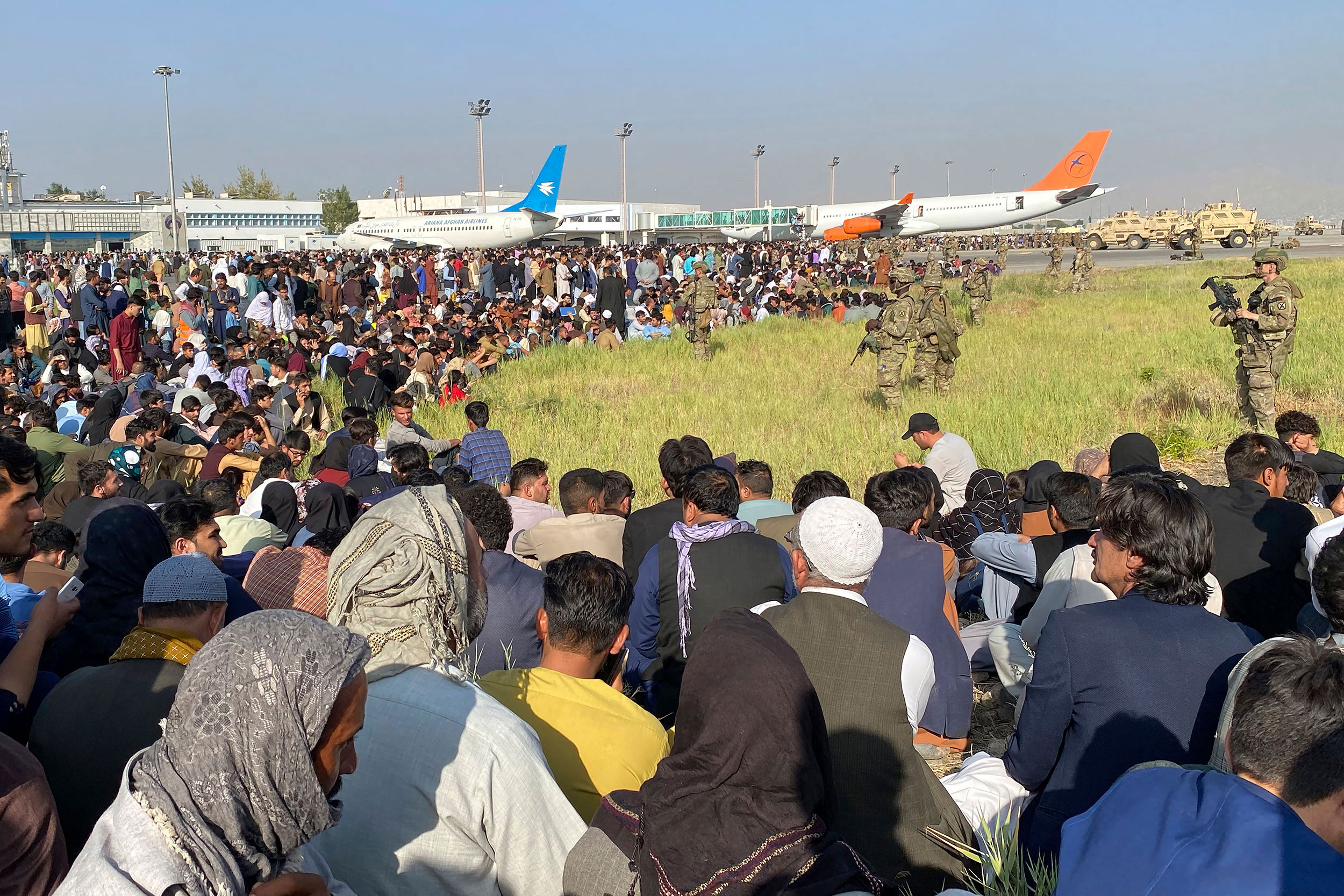 Kabul airport with soldiers and Afghans.