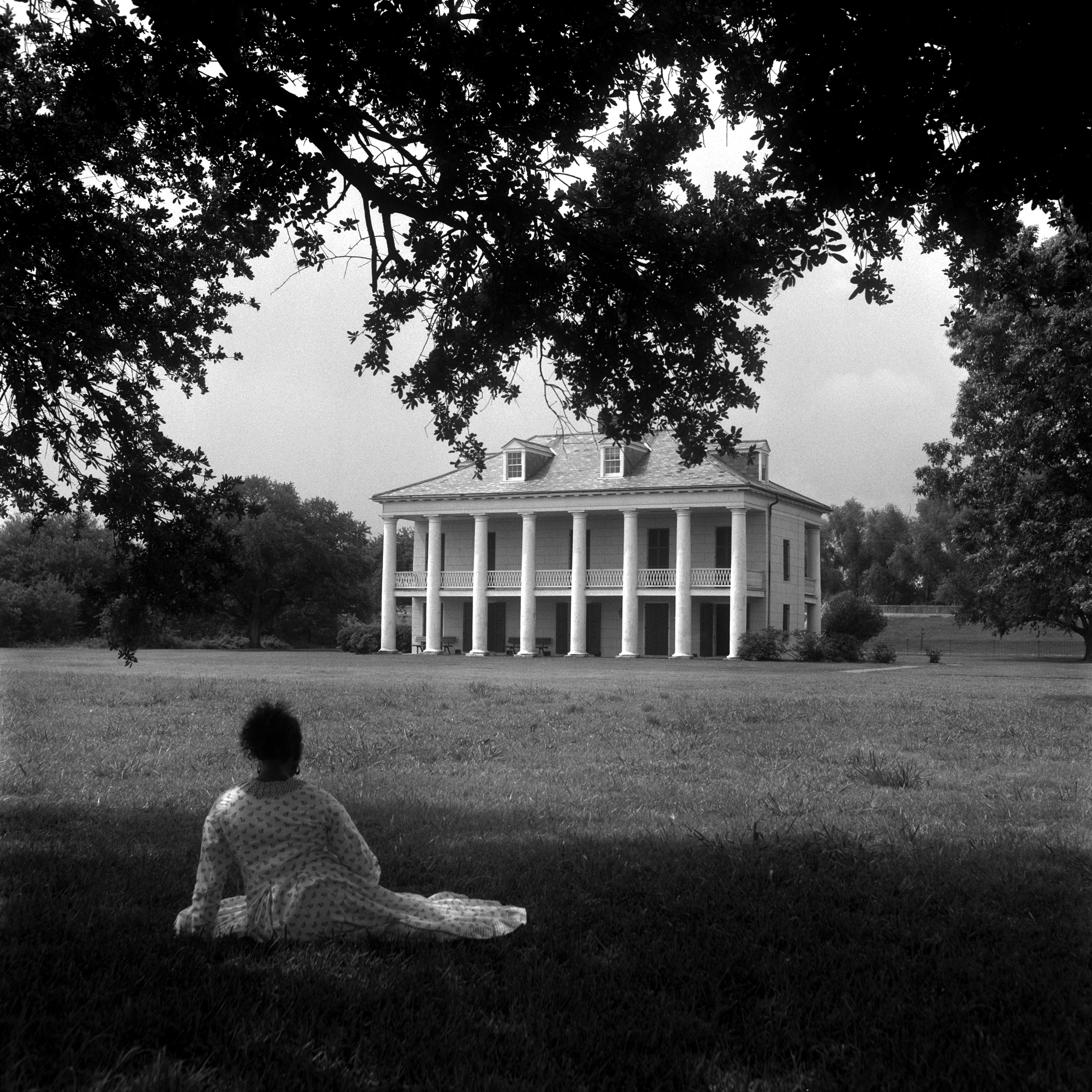 woman looking at a house.