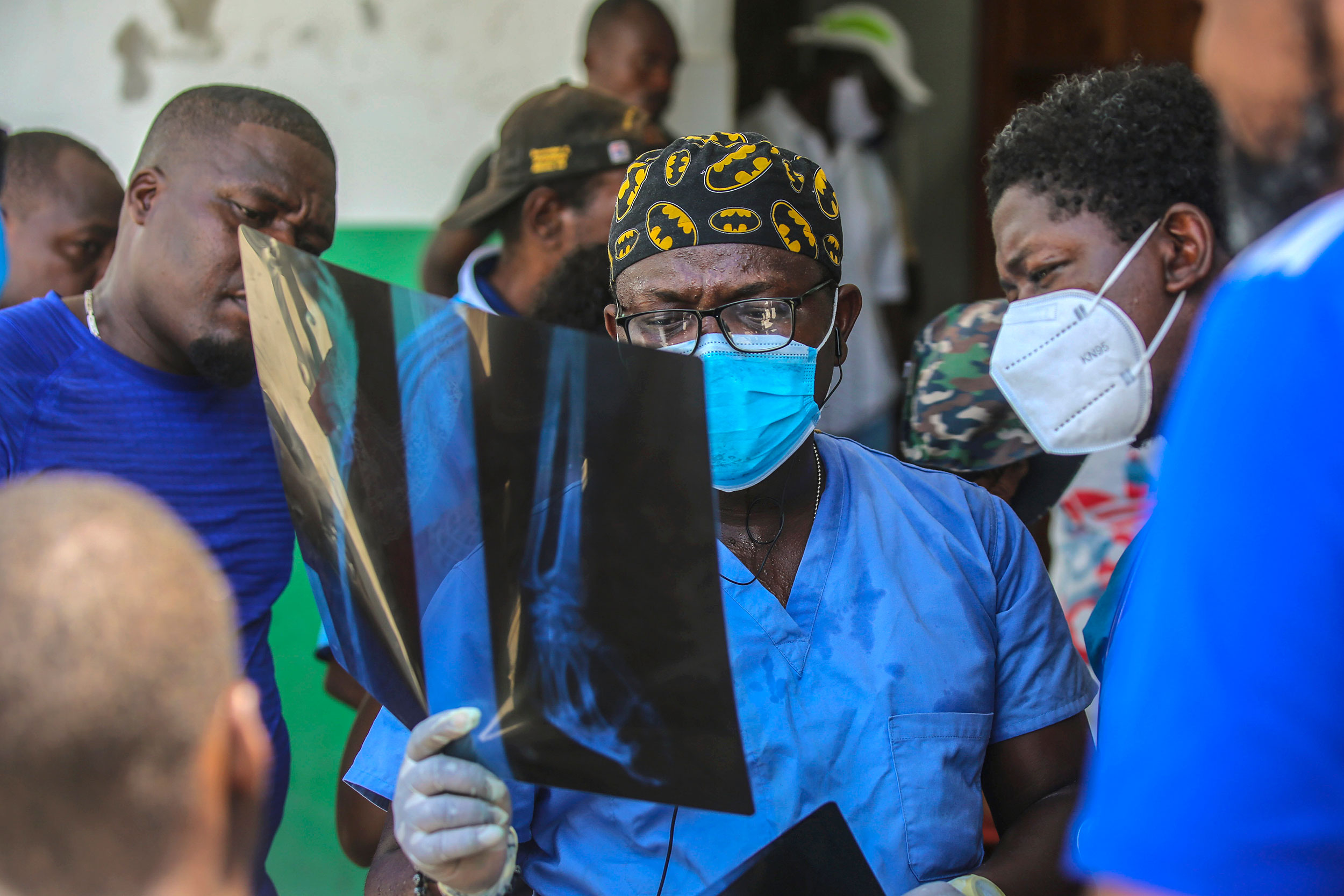 Haitian doctor looks at X-ray.