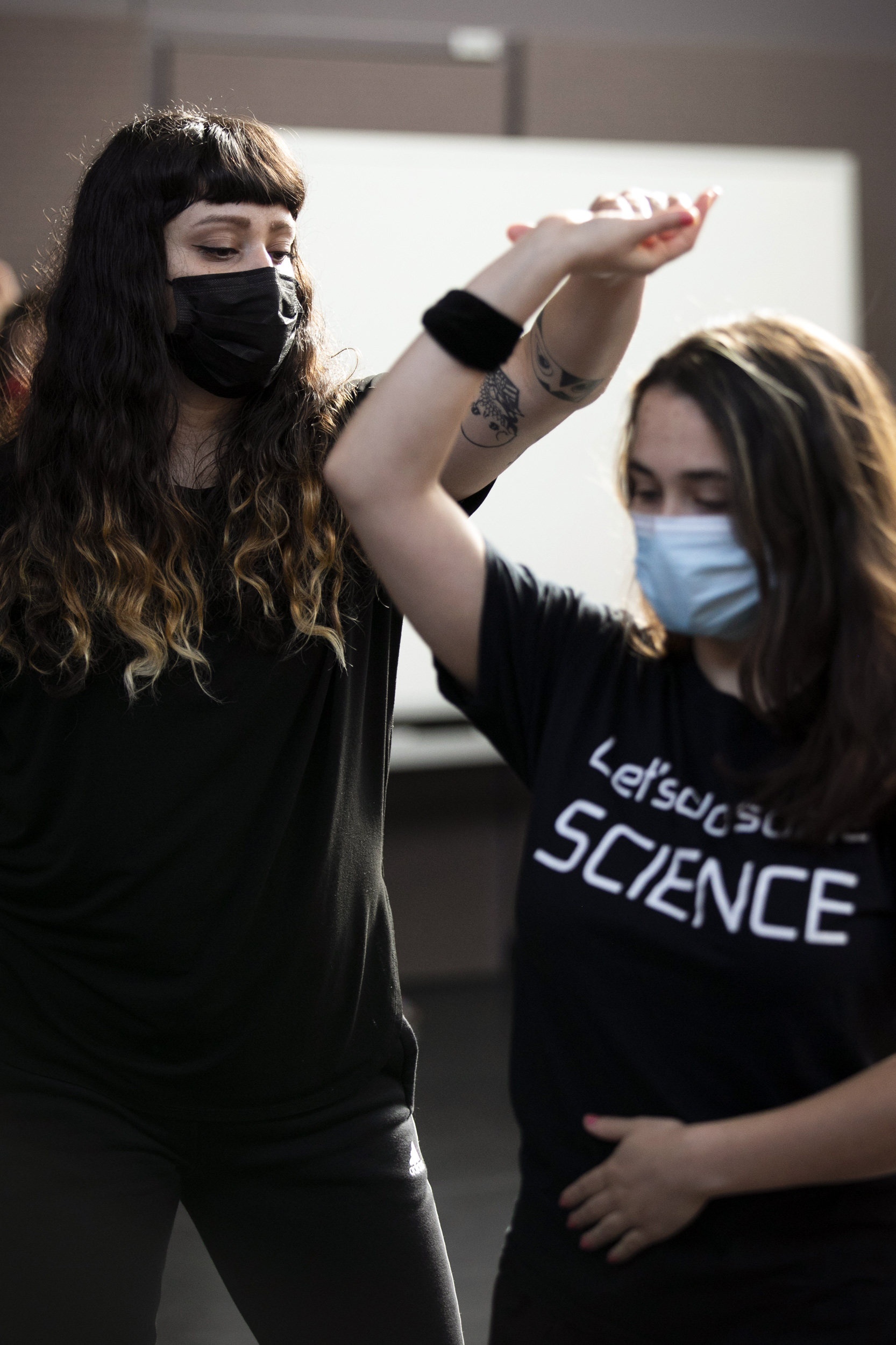 Laura Rodriguez (left) and Athena Capo-Battaglia '23 demonstrate a dance sequence in Farkas Hall.