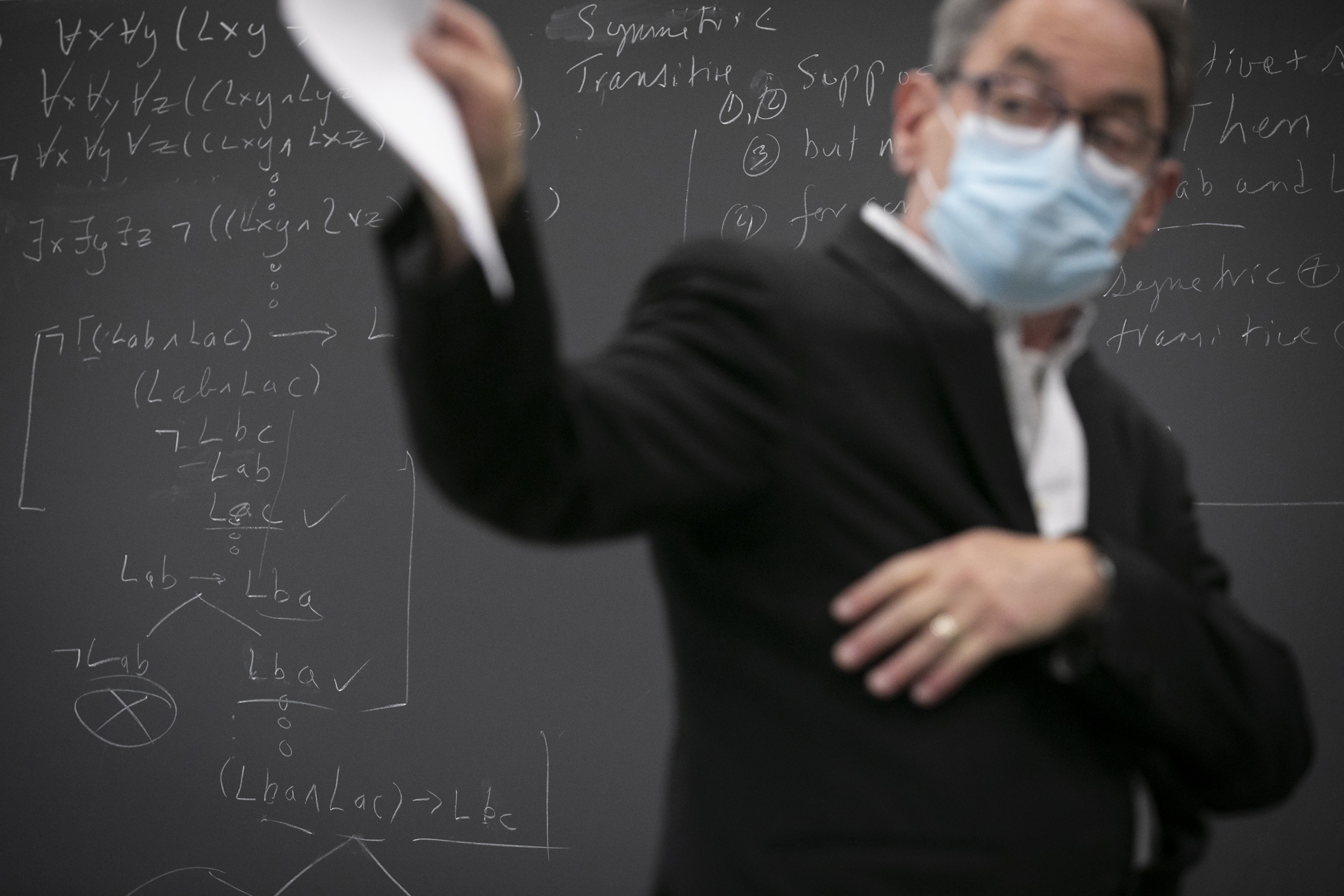 Mark Richard lectures in front of chalkboard.