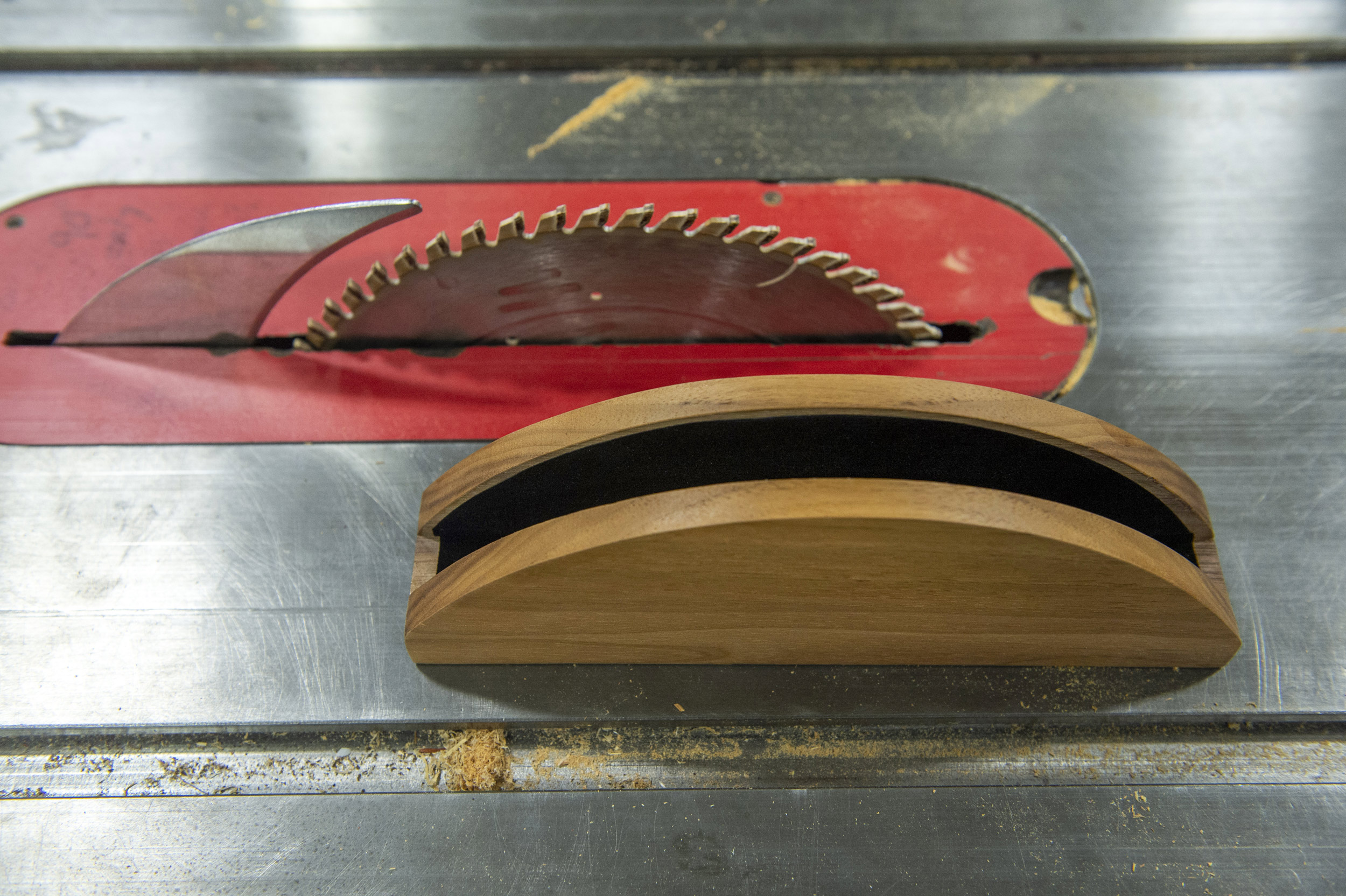 Walnut laptop holder with table saw.